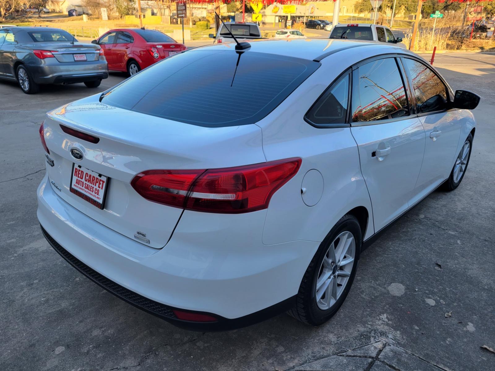 2018 WHITE /Beige Ford Focus SE Sedan (1FADP3FE9JL) with an 1.0L L3 engine, Manual transmission, located at 503 West Court, Seguin, TX, 78155, (830) 379-3373, 29.568621, -97.969803 - 2018 Ford Focus SE Sedan with a 1.0L L3, Standard, Tilt, Cruise, AM/FM Stereo, Power Windows, Locks and Side Mirrors, Bluetooth, Dual Climate Control, Tinted Windows, Alloy Wheels, Backup Camera, Rear Defroster and more!! - Photo #2