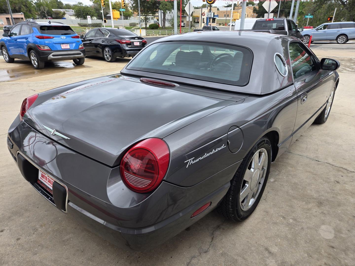 2003 Gray /Black Ford Thunderbird Deluxe (1FAHP60A13Y) with an 3.9L V8 DOHC 32V engine, 5-Speed Automatic Overdrive transmission, located at 503 West Court, Seguin, TX, 78155, (830) 379-3373, 29.568621, -97.969803 - 2003 Ford Thunderbird Deluxe with a 3.9L V8 DOHC 32V, Automatic, Tilt, Cruise, AM/FM/CD Stereo, Power Windows and Locks, Dual Climate Control, Power Convertible Top, Automatic Headlights, Removeable Hard Top and Hard Top Storage Cart, Alloy Wheels and more!!- Photo#2