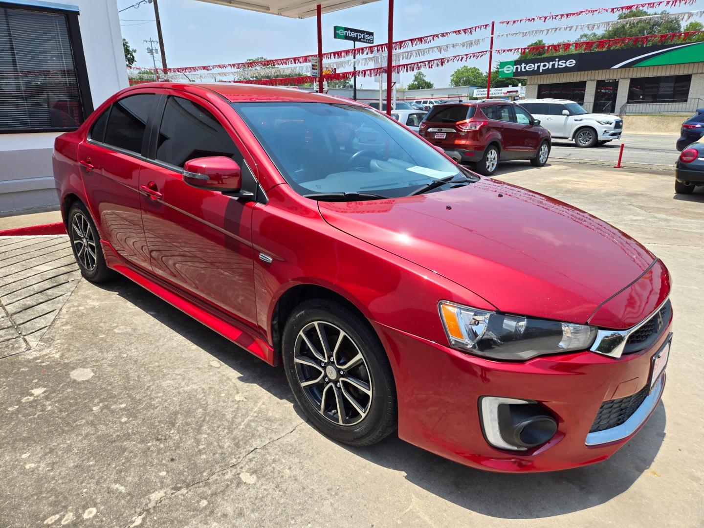 2017 Red /Black Mitsubishi Lancer ES 5M (JA32U2FU2HU) with an 2.0L L4 SOHC 16V engine, Automatic transmission, located at 503 West Court, Seguin, TX, 78155, (830) 379-3373, 29.568621, -97.969803 - Photo#1