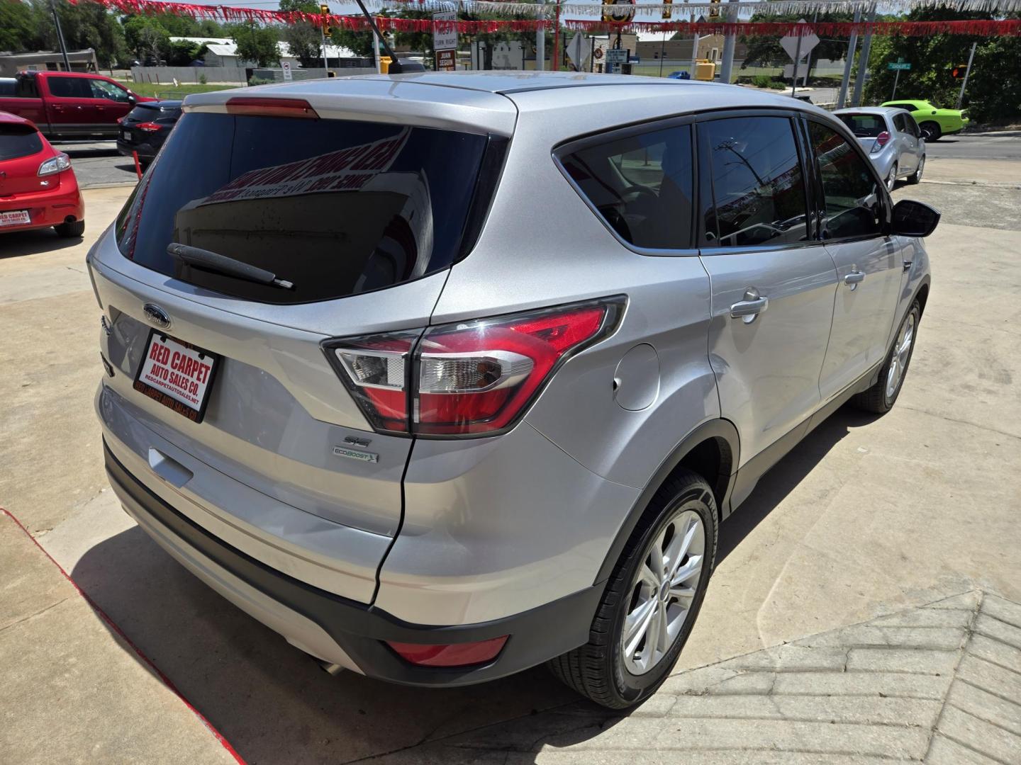 2017 SILVER Ford Escape SE FWD (1FMCU0GD4HU) with an 1.5L L4 DOHC 16V engine, 6A transmission, located at 503 West Court, Seguin, TX, 78155, (830) 379-3373, 29.568621, -97.969803 - Photo#2