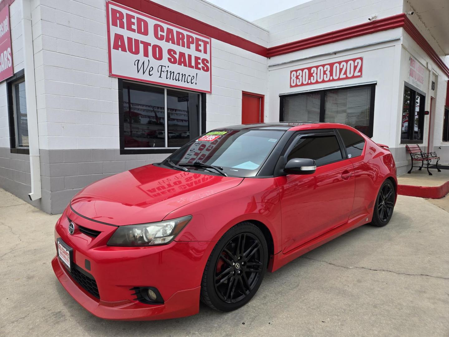 2013 Red Scion tC Sports Coupe 6-Spd AT (JTKJF5C74D3) with an 2.4L L4 DOHC 16V engine, Manual Transmission transmission, located at 503 West Court, Seguin, TX, 78155, (830) 379-3373, 29.568621, -97.969803 - Photo#0