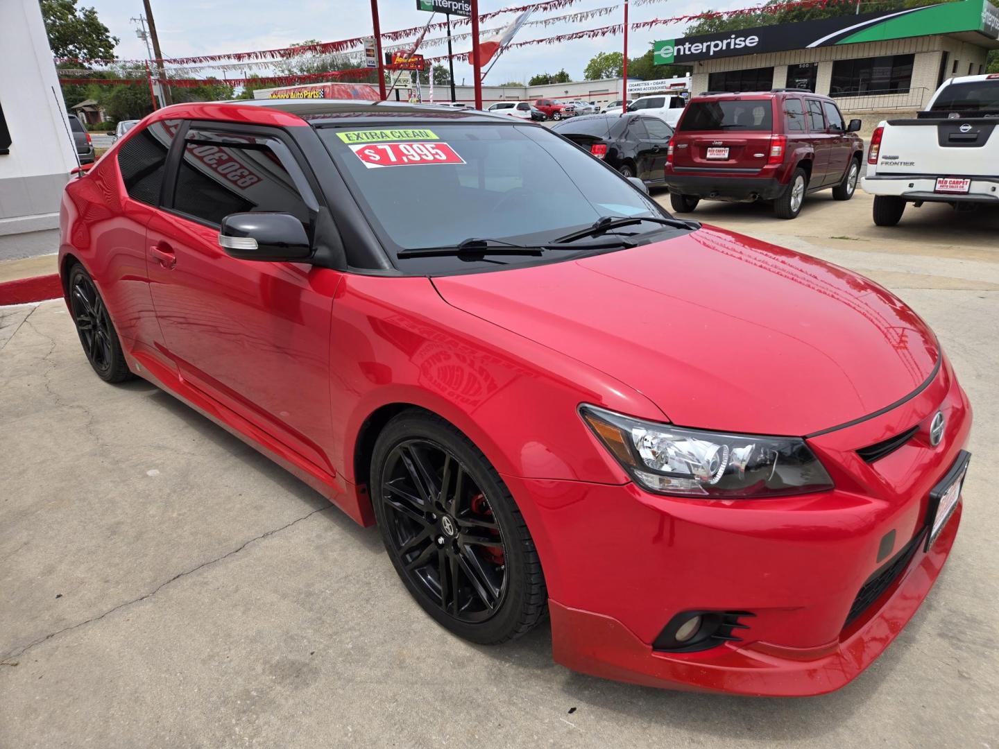 2013 Red Scion tC Sports Coupe 6-Spd AT (JTKJF5C74D3) with an 2.4L L4 DOHC 16V engine, Manual Transmission transmission, located at 503 West Court, Seguin, TX, 78155, (830) 379-3373, 29.568621, -97.969803 - Photo#1