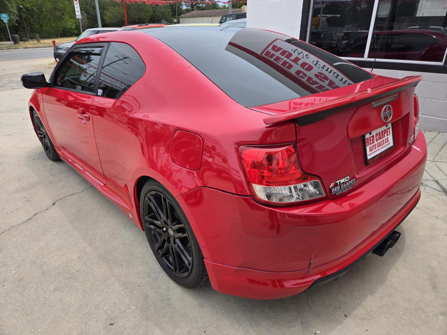 2013 Red Scion tC Sports Coupe 6-Spd AT (JTKJF5C74D3) with an 2.4L L4 DOHC 16V engine, Manual Transmission transmission, located at 503 West Court, Seguin, TX, 78155, (830) 379-3373, 29.568621, -97.969803 - Photo#3