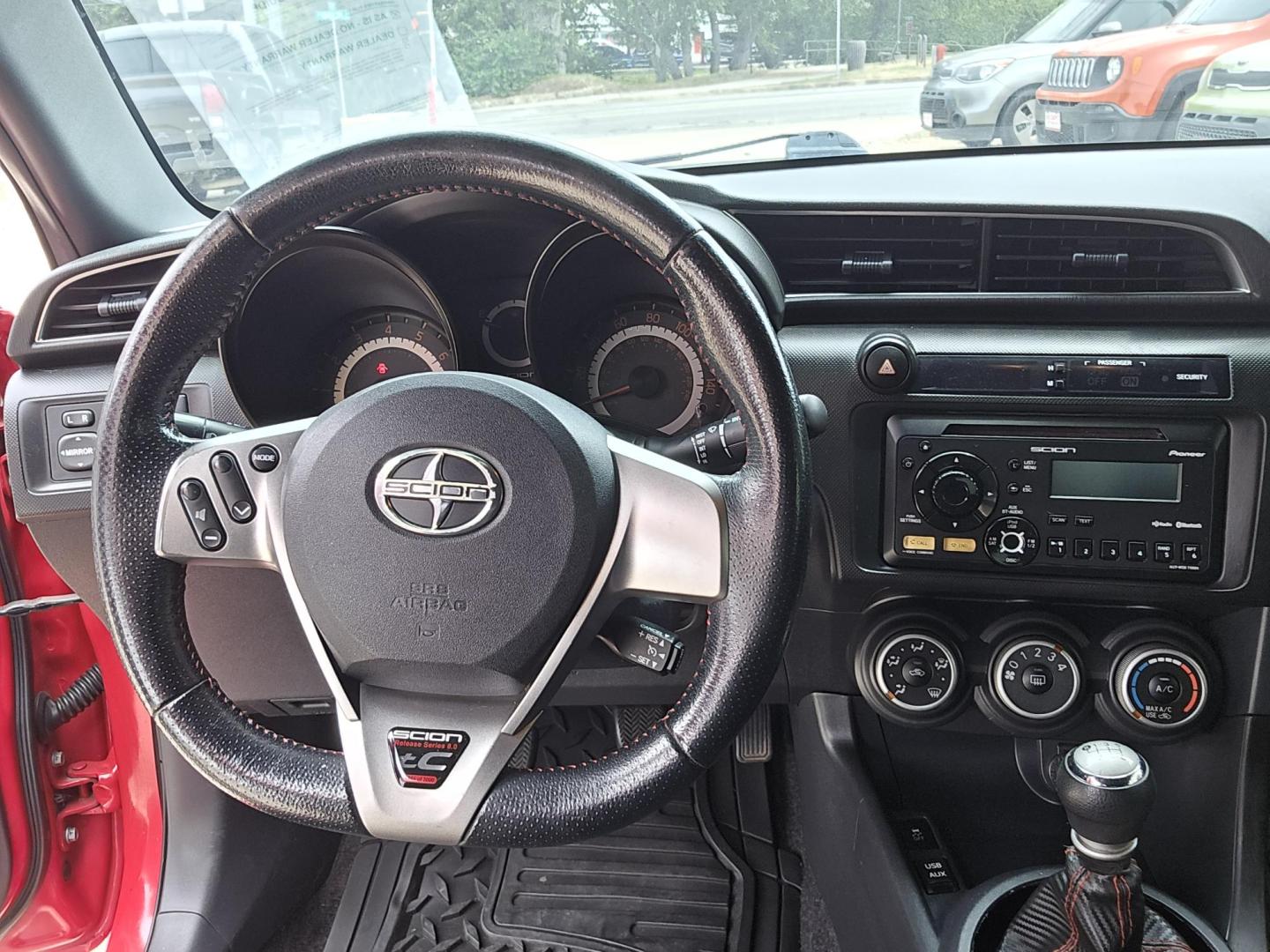 2013 Red Scion tC Sports Coupe 6-Spd AT (JTKJF5C74D3) with an 2.4L L4 DOHC 16V engine, Manual Transmission transmission, located at 503 West Court, Seguin, TX, 78155, (830) 379-3373, 29.568621, -97.969803 - Photo#5