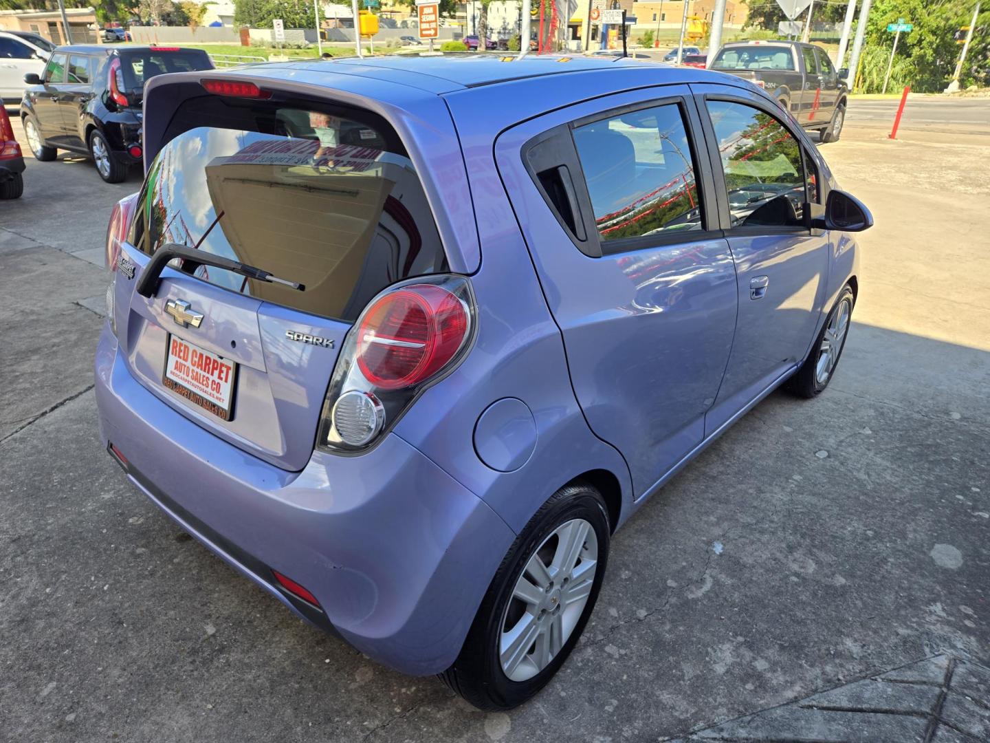 2015 Purple Chevrolet Spark LS Manual (KL8CA6S93FC) with an 1.2L L4 16V DOHC engine, 5-Speed Manual transmission, located at 503 West Court, Seguin, TX, 78155, (830) 379-3373, 29.568621, -97.969803 - Photo#2