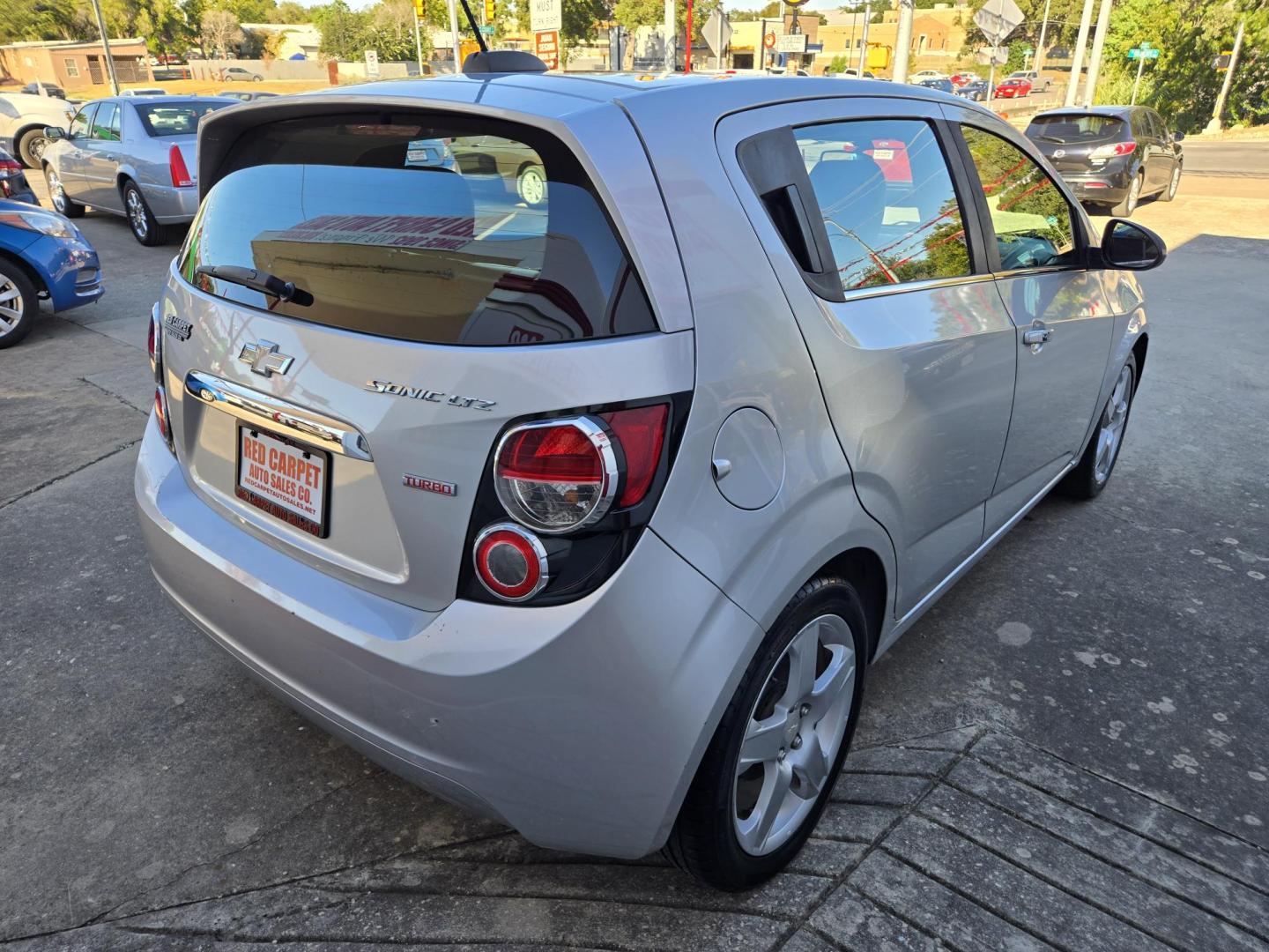 2016 Chevrolet Sonic LTZ Auto 5-Door (1G1JE6SB9G4) with an 1.4L L4 DOHC 24V TURBO engine, 6A transmission, located at 503 West Court, Seguin, TX, 78155, (830) 379-3373, 29.568621, -97.969803 - 2016 Chevrolet Sonic LTZ Auto 5-Door with a 1.4L L4 DOHC 24V TURBO, Automatic, Tilt, Cruise, AM/FM Touchscreen Stereo, Power Windows, Locks and Side Mirrors, Bluetooth, Onstar Capability, Alloy Wheels, Automatic Headlights, Rear Wiper, Rear Defroster and more!! - Photo#2