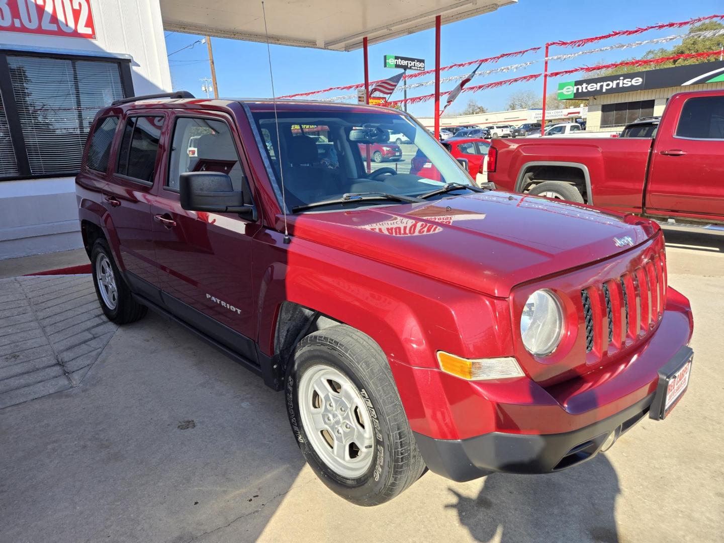 2015 Red Jeep Patriot Sport 2WD (1C4NJPBB7FD) with an 2.4L L4 DOHC 16V engine, Automatic transmission, located at 503 West Court, Seguin, TX, 78155, (830) 379-3373, 29.568621, -97.969803 - Photo#1