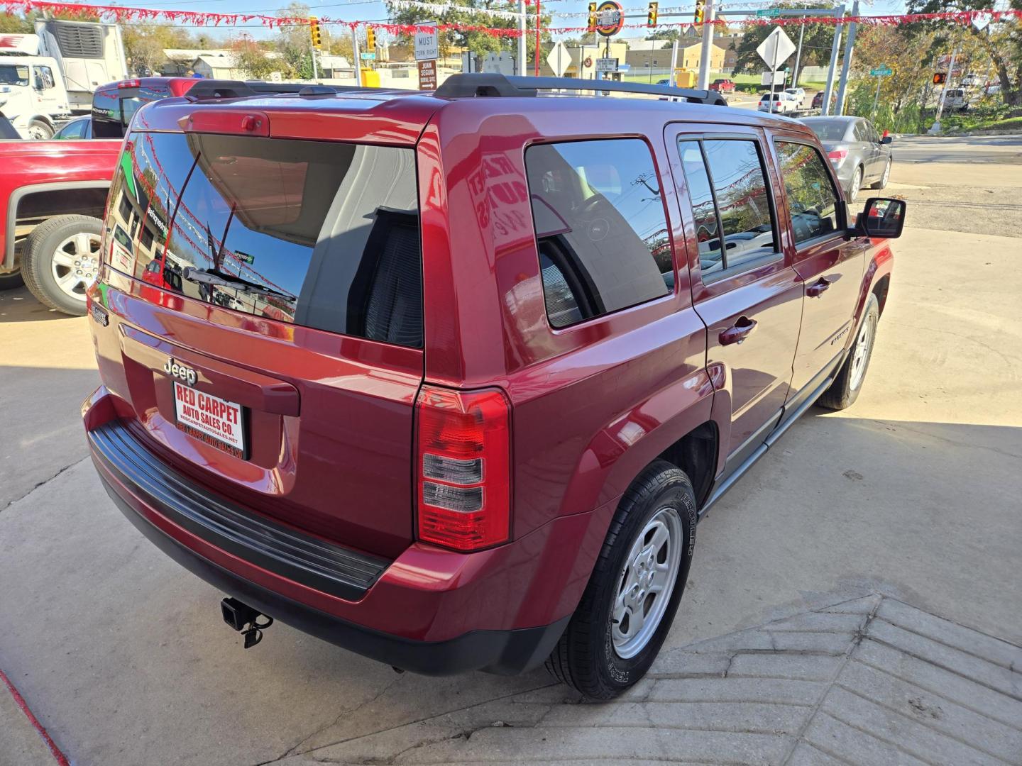 2015 Red Jeep Patriot Sport 2WD (1C4NJPBB7FD) with an 2.4L L4 DOHC 16V engine, Automatic transmission, located at 503 West Court, Seguin, TX, 78155, (830) 379-3373, 29.568621, -97.969803 - Photo#2