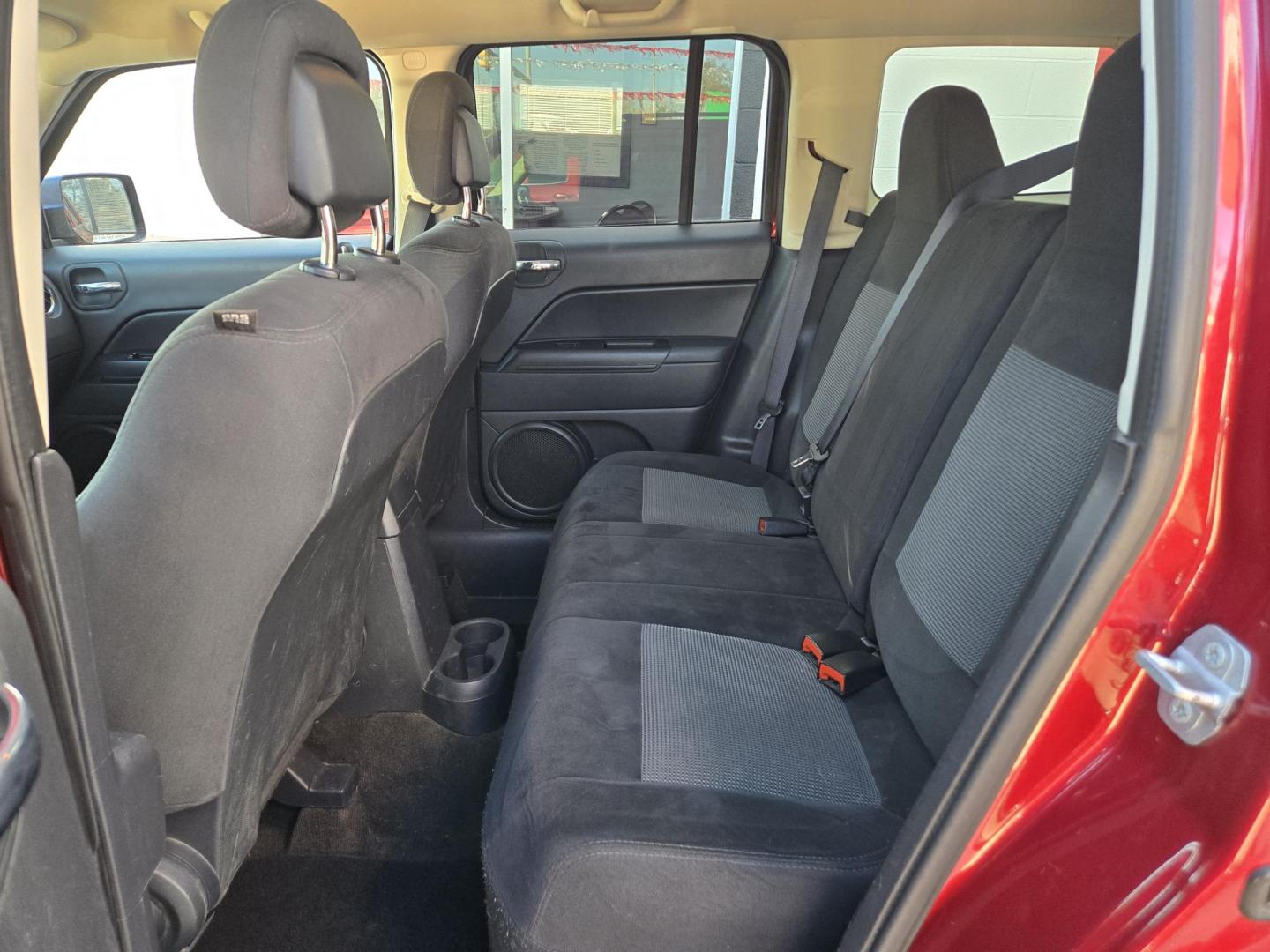 2015 Red Jeep Patriot Sport 2WD (1C4NJPBB7FD) with an 2.4L L4 DOHC 16V engine, Automatic transmission, located at 503 West Court, Seguin, TX, 78155, (830) 379-3373, 29.568621, -97.969803 - Photo#6
