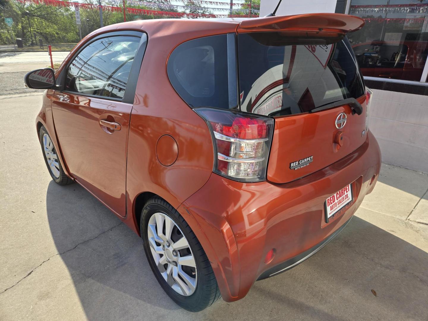 2012 Orange Scion iQ 3-Door Hatchback AT (JTNJJXB06CJ) with an 1.3L L4 engine, Continuously Variable Transmission transmission, located at 503 West Court, Seguin, TX, 78155, (830) 379-3373, 29.568621, -97.969803 - 2012 Scion iQ 3-Door Hatchback with a 1.3L L4, Automatic, Tilt, AM/FM/AUX Touchscreen Stereo, Power Windows, Locks and Side Mirrors, Tinted Windows, Rear Defroster and more!! - Photo#3