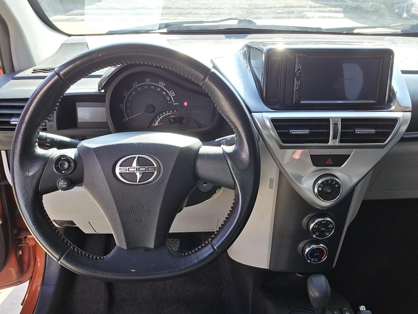 2012 Orange Scion iQ 3-Door Hatchback AT (JTNJJXB06CJ) with an 1.3L L4 engine, Continuously Variable Transmission transmission, located at 503 West Court, Seguin, TX, 78155, (830) 379-3373, 29.568621, -97.969803 - 2012 Scion iQ 3-Door Hatchback with a 1.3L L4, Automatic, Tilt, AM/FM/AUX Touchscreen Stereo, Power Windows, Locks and Side Mirrors, Tinted Windows, Rear Defroster and more!! - Photo#5