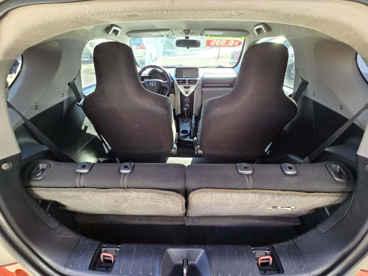 2012 Orange Scion iQ 3-Door Hatchback AT (JTNJJXB06CJ) with an 1.3L L4 engine, Continuously Variable Transmission transmission, located at 503 West Court, Seguin, TX, 78155, (830) 379-3373, 29.568621, -97.969803 - 2012 Scion iQ 3-Door Hatchback with a 1.3L L4, Automatic, Tilt, AM/FM/AUX Touchscreen Stereo, Power Windows, Locks and Side Mirrors, Tinted Windows, Rear Defroster and more!! - Photo#7