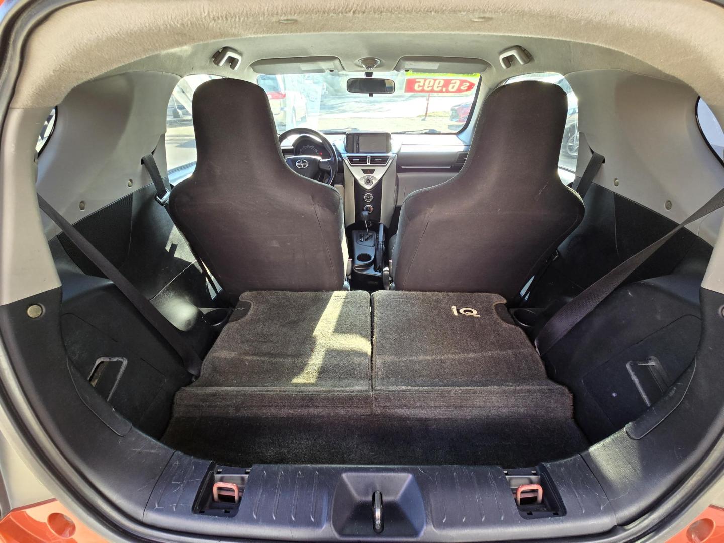 2012 Orange Scion iQ 3-Door Hatchback AT (JTNJJXB06CJ) with an 1.3L L4 engine, Continuously Variable Transmission transmission, located at 503 West Court, Seguin, TX, 78155, (830) 379-3373, 29.568621, -97.969803 - 2012 Scion iQ 3-Door Hatchback with a 1.3L L4, Automatic, Tilt, AM/FM/AUX Touchscreen Stereo, Power Windows, Locks and Side Mirrors, Tinted Windows, Rear Defroster and more!! - Photo#8