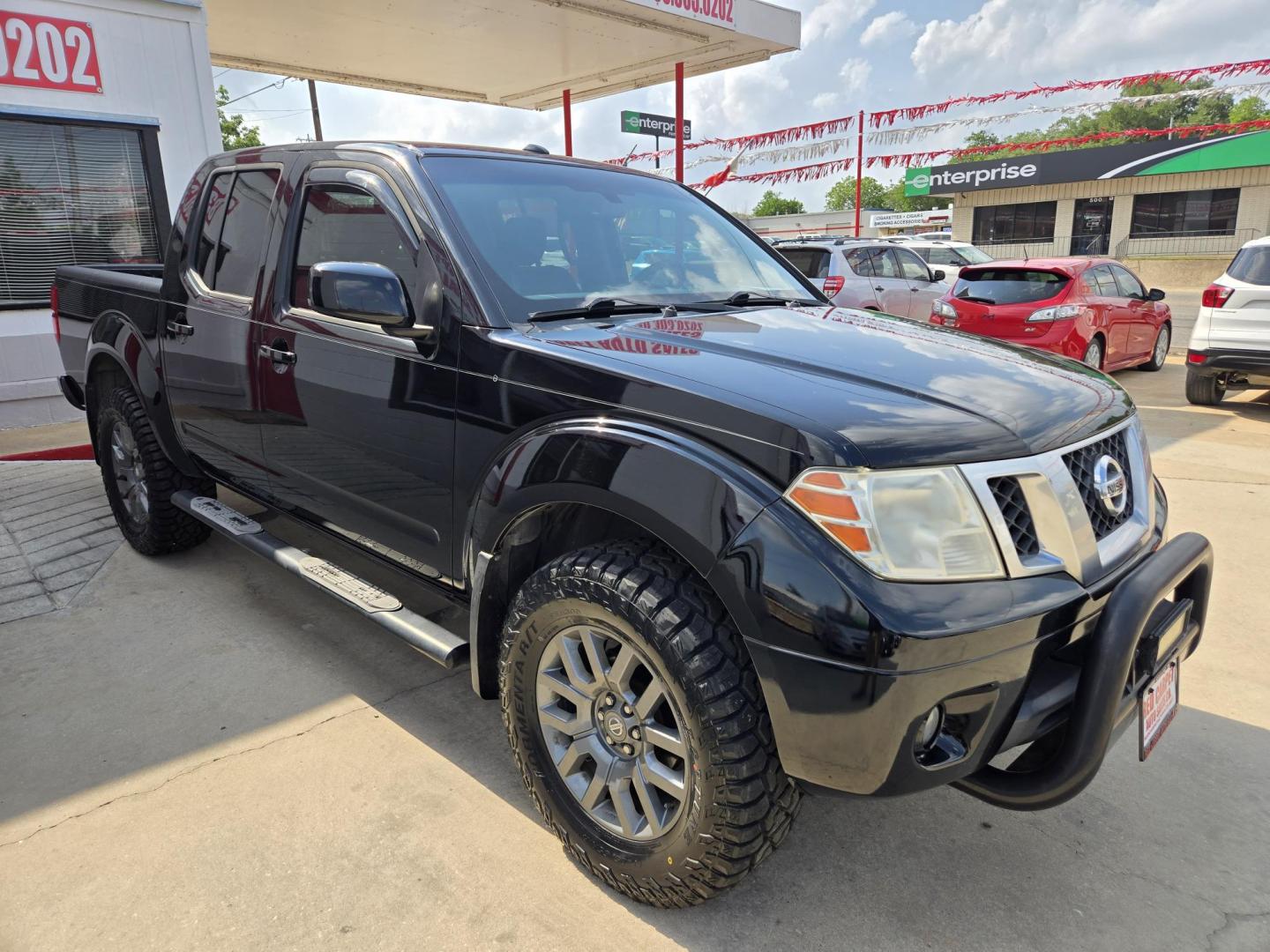 2014 Black Nissan Frontier SL Crew Cab 4WD (1N6AD0EV7EN) with an 4.0L V6 DOHC 24V engine, 5-Speed Automatic transmission, located at 503 West Court, Seguin, TX, 78155, (830) 379-3373, 29.568621, -97.969803 - 2014 Nissan Frontier SL Crew Cab 4WD with a 4.0L V6 DOHC 24V, Automatic, Tilt, Cruise, AM/FM/CD/AUX Stereo, Power Windows, Locks and Side Mirrors, Bluetooth, Dual Climate Control, Heated Seats, Tinted Windows, Running Boards, Alloy Wheels and more!! - Photo#1