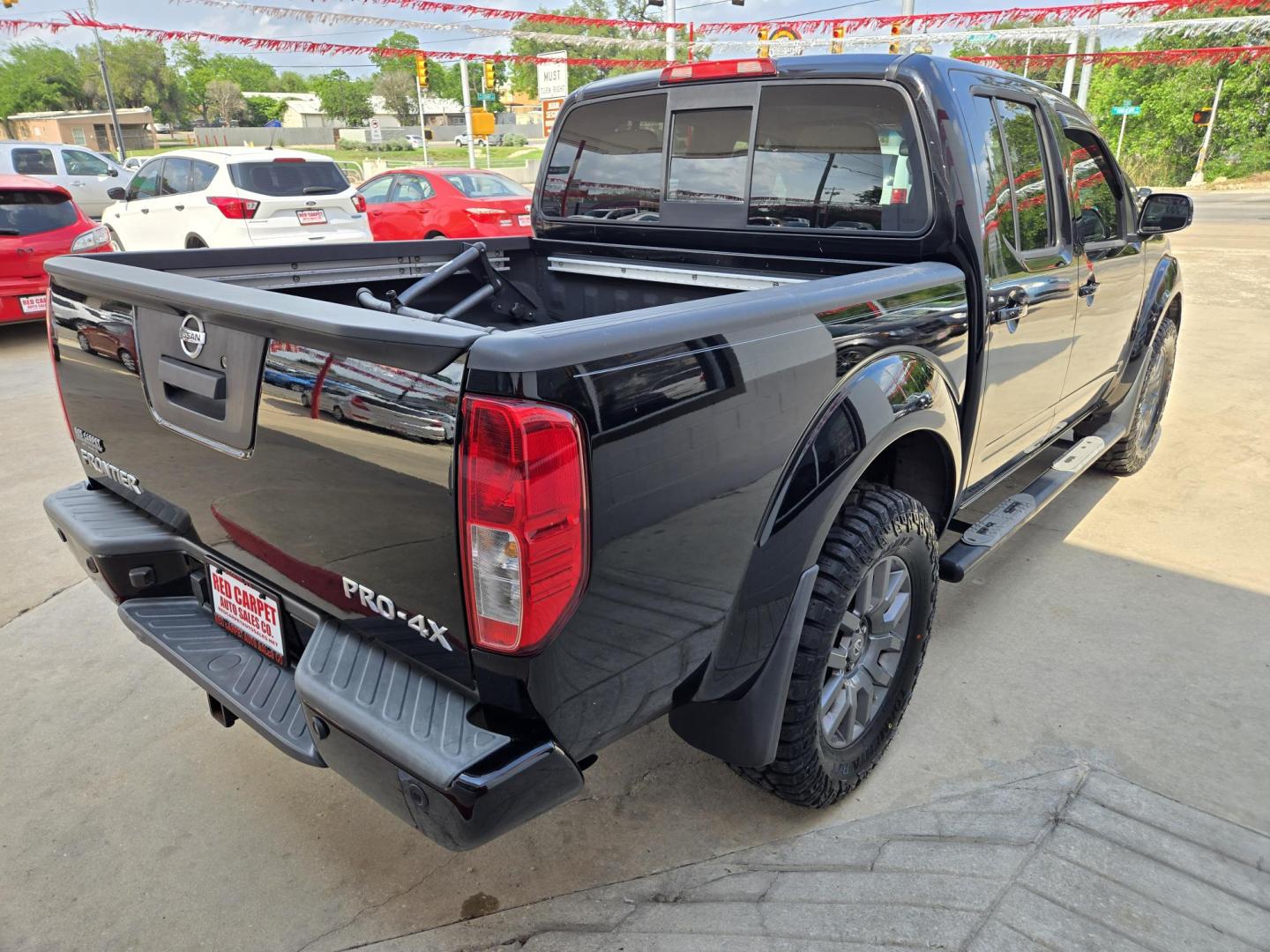 2014 Black Nissan Frontier SL Crew Cab 4WD (1N6AD0EV7EN) with an 4.0L V6 DOHC 24V engine, 5-Speed Automatic transmission, located at 503 West Court, Seguin, TX, 78155, (830) 379-3373, 29.568621, -97.969803 - 2014 Nissan Frontier SL Crew Cab 4WD with a 4.0L V6 DOHC 24V, Automatic, Tilt, Cruise, AM/FM/CD/AUX Stereo, Power Windows, Locks and Side Mirrors, Bluetooth, Dual Climate Control, Heated Seats, Tinted Windows, Running Boards, Alloy Wheels and more!! - Photo#2