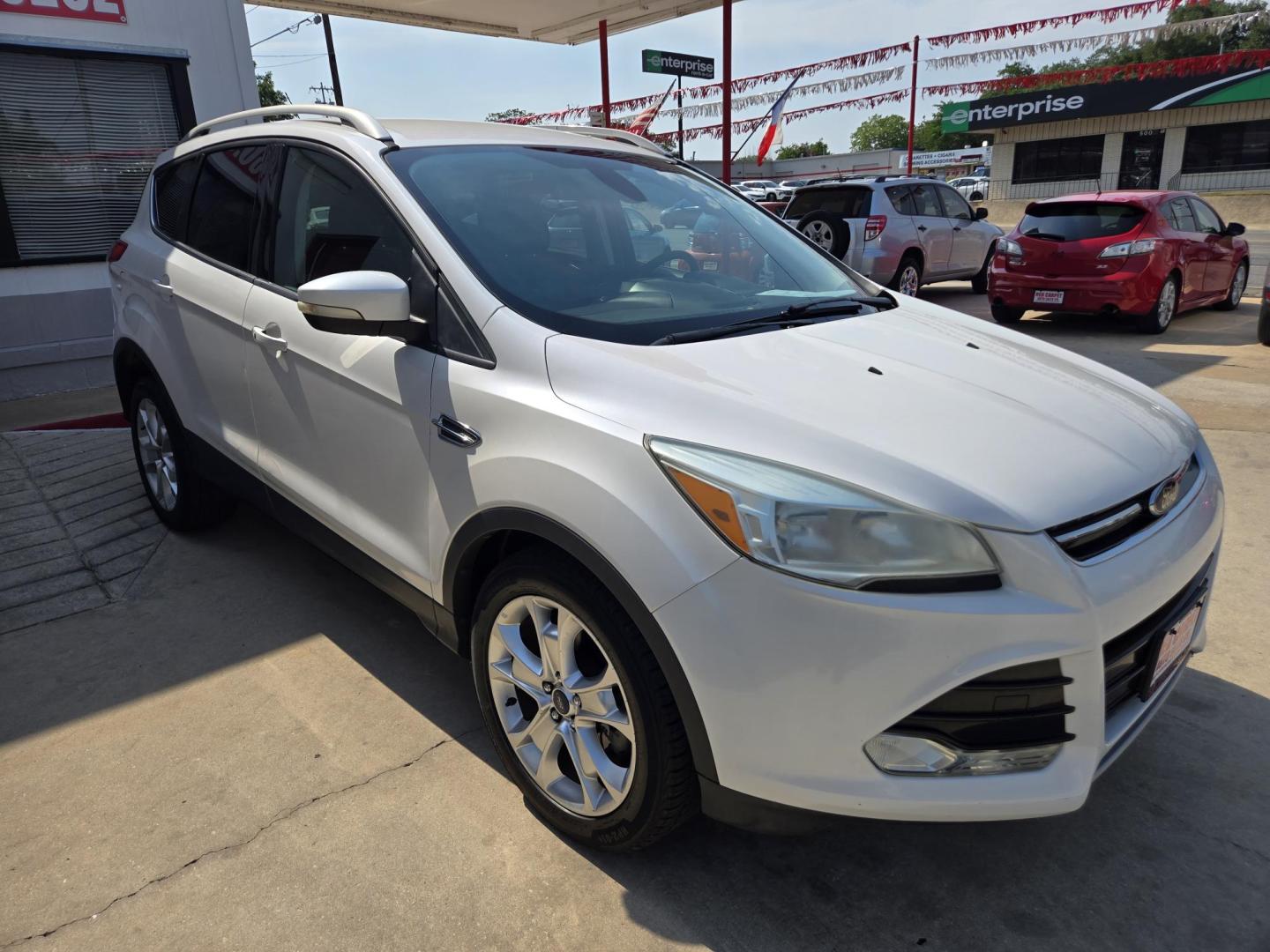 2014 WHITE Ford Escape Titanium FWD (1FMCU0J95EU) with an 2.0L L4 DOHC 16V engine, 6-Speed Automatic transmission, located at 503 West Court, Seguin, TX, 78155, (830) 379-3373, 29.568621, -97.969803 - 2014 Ford Escape Titanium FWD with a 2.0L L4 DOHC 16V, Automatic, Tilt, Cruise, AM/FM/CD Stereo, Power Windows, Locks, Seat and Side Mirrors, Bluetooth, Leather Seats, Tinted Windows, Dual Climate Control, Heated Seats, Power Rear Hatch, Alloy Wheels, Backup Camera, Bumper Sensors, Rear Wiper, Rear - Photo#1