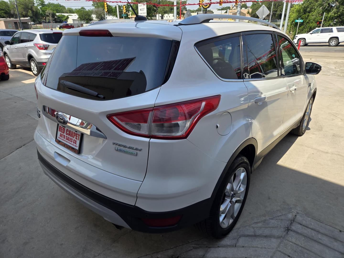 2014 WHITE Ford Escape Titanium FWD (1FMCU0J95EU) with an 2.0L L4 DOHC 16V engine, 6-Speed Automatic transmission, located at 503 West Court, Seguin, TX, 78155, (830) 379-3373, 29.568621, -97.969803 - 2014 Ford Escape Titanium FWD with a 2.0L L4 DOHC 16V, Automatic, Tilt, Cruise, AM/FM/CD Stereo, Power Windows, Locks, Seat and Side Mirrors, Bluetooth, Leather Seats, Tinted Windows, Dual Climate Control, Heated Seats, Power Rear Hatch, Alloy Wheels, Backup Camera, Bumper Sensors, Rear Wiper, Rear - Photo#2