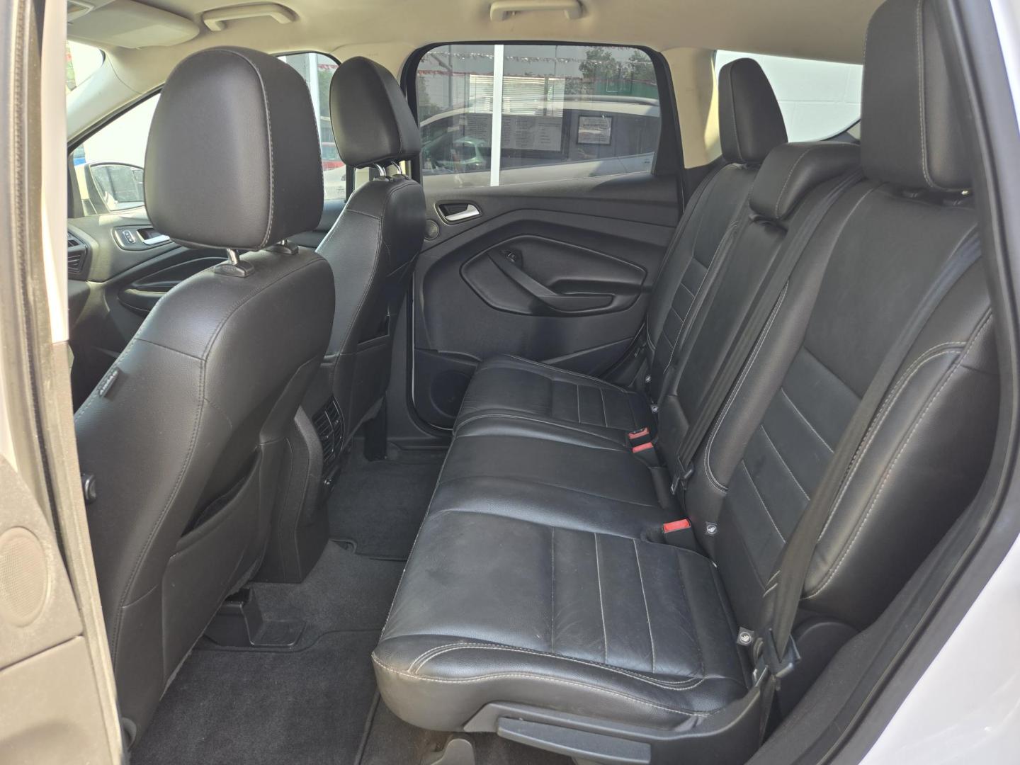 2014 WHITE Ford Escape Titanium FWD (1FMCU0J95EU) with an 2.0L L4 DOHC 16V engine, 6-Speed Automatic transmission, located at 503 West Court, Seguin, TX, 78155, (830) 379-3373, 29.568621, -97.969803 - 2014 Ford Escape Titanium FWD with a 2.0L L4 DOHC 16V, Automatic, Tilt, Cruise, AM/FM/CD Stereo, Power Windows, Locks, Seat and Side Mirrors, Bluetooth, Leather Seats, Tinted Windows, Dual Climate Control, Heated Seats, Power Rear Hatch, Alloy Wheels, Backup Camera, Bumper Sensors, Rear Wiper, Rear - Photo#6