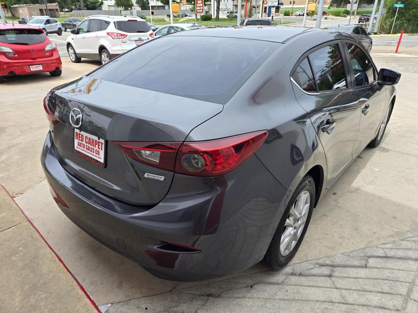 2016 Mazda MAZDA3 i Sport AT 4-Door (JM1BM1U74G1) with an 2.0L L4 DOHC 16V engine, Automatic transmission, located at 503 West Court, Seguin, TX, 78155, (830) 379-3373, 29.568621, -97.969803 - 2016 Mazda MAZDA3 i Sport AT 4-Door with a 2.0L L4 DOHC 16V, Automatic, Tilt, Cruise, AM/FM/AUX Stereo, Power Windows, Locks and Side Mirrors, Bluetooth, Tinted Windows, Backup Camera, Alloy Wheels, Rear Defroster and more!! - Photo#2