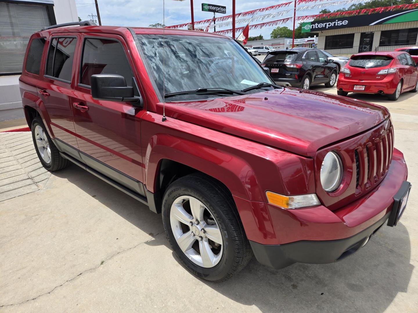 2016 Red Jeep Patriot Latitude 2WD (1C4NJPFB2GD) with an 2.4L L4 DOHC 16V engine, Automatic transmission, located at 503 West Court, Seguin, TX, 78155, (830) 379-3373, 29.568621, -97.969803 - 2016 Jeep Patriot Latitude 2WD with a 2.4L L4 DOHC 16V, Automatic, Tilt, Cruise, AM/FM/CD Touchscreen Stereo, Power Windows, Locks and Side Mirrors, Bluetooth, Navigation, Heated Seats, Alloy Wheels, Rear Wiper, Rear Defroster and more!! - Photo#1