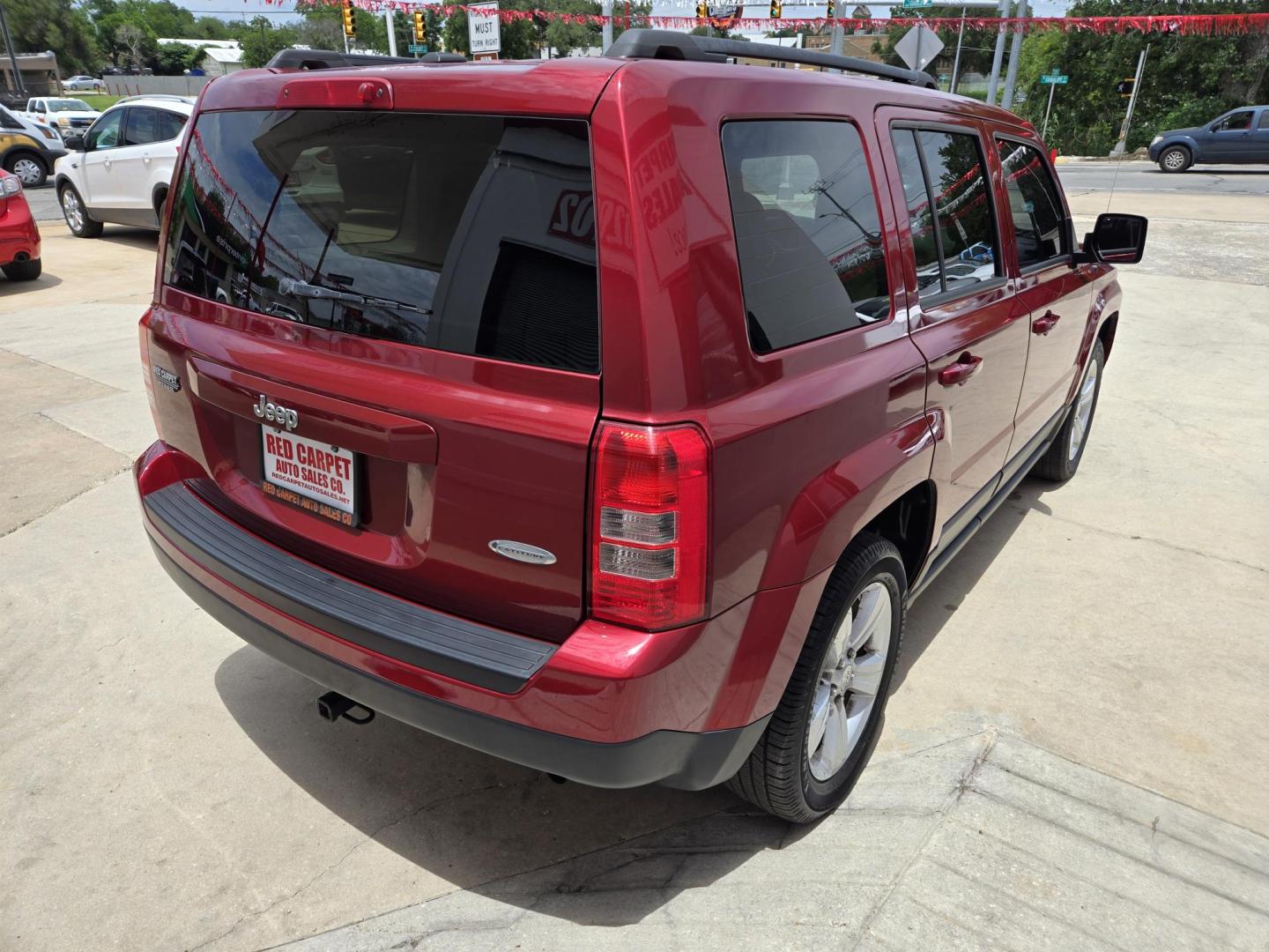 2016 Red Jeep Patriot Latitude 2WD (1C4NJPFB2GD) with an 2.4L L4 DOHC 16V engine, Automatic transmission, located at 503 West Court, Seguin, TX, 78155, (830) 379-3373, 29.568621, -97.969803 - 2016 Jeep Patriot Latitude 2WD with a 2.4L L4 DOHC 16V, Automatic, Tilt, Cruise, AM/FM/CD Touchscreen Stereo, Power Windows, Locks and Side Mirrors, Bluetooth, Navigation, Heated Seats, Alloy Wheels, Rear Wiper, Rear Defroster and more!! - Photo#2