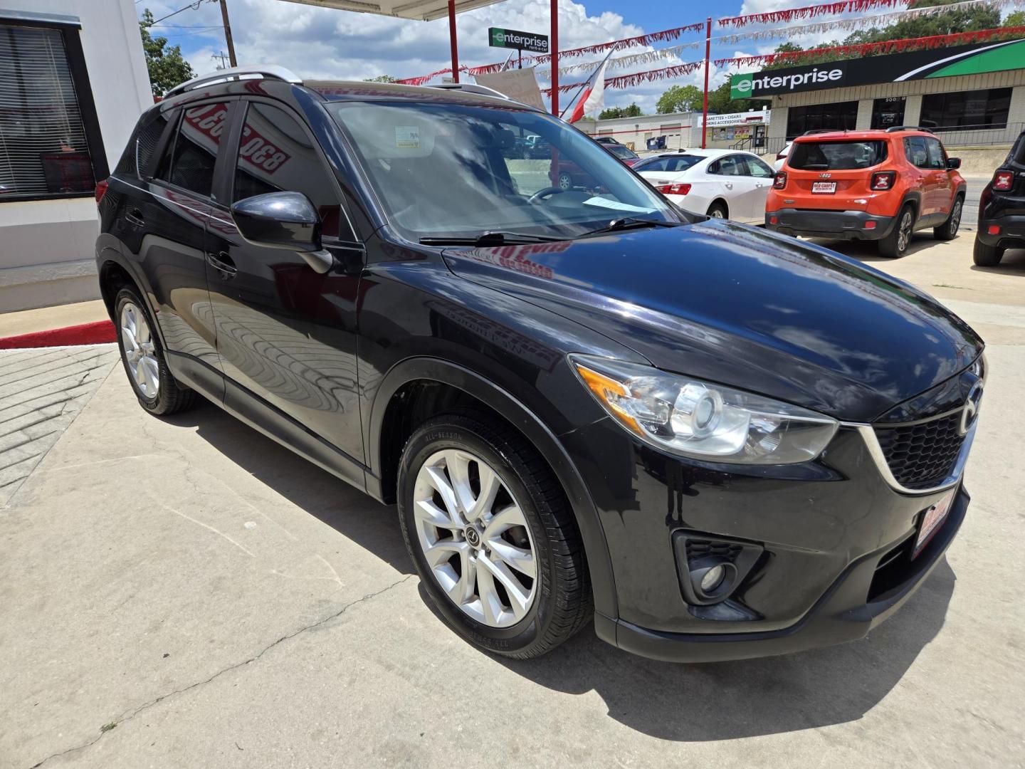 2013 Black Mazda CX-5 Grand Touring (JM3KE2DE9D0) with an 2.0L I4 F DOHC 16V engine, 6-Speed Automatic transmission, located at 503 West Court, Seguin, TX, 78155, (830) 379-3373, 29.568621, -97.969803 - 2013 Mazda CX-5 Grand Touring with a 2.0L I4 F DOHC 16V, Automatic, Tilt, Cruise, AM/FM/CD Touchscreen Stereo, Power Windows, Locks, Seat and Side Mirrors, Bluetooth, Leather Seating, Power Sunroof, Dual Climate Control, Heated Seats, Navigation System, Alloy Wheels, Backup Camera, Rear Wiper, Rear - Photo#1