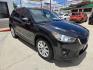 2013 Black Mazda CX-5 Grand Touring (JM3KE2DE9D0) with an 2.0L I4 F DOHC 16V engine, 6-Speed Automatic transmission, located at 503 West Court, Seguin, TX, 78155, (830) 379-3373, 29.568621, -97.969803 - 2013 Mazda CX-5 Grand Touring with a 2.0L I4 F DOHC 16V, Automatic, Tilt, Cruise, AM/FM/CD Touchscreen Stereo, Power Windows, Locks, Seat and Side Mirrors, Bluetooth, Leather Seating, Power Sunroof, Dual Climate Control, Heated Seats, Navigation System, Alloy Wheels, Backup Camera, Rear Wiper, Rear - Photo#1