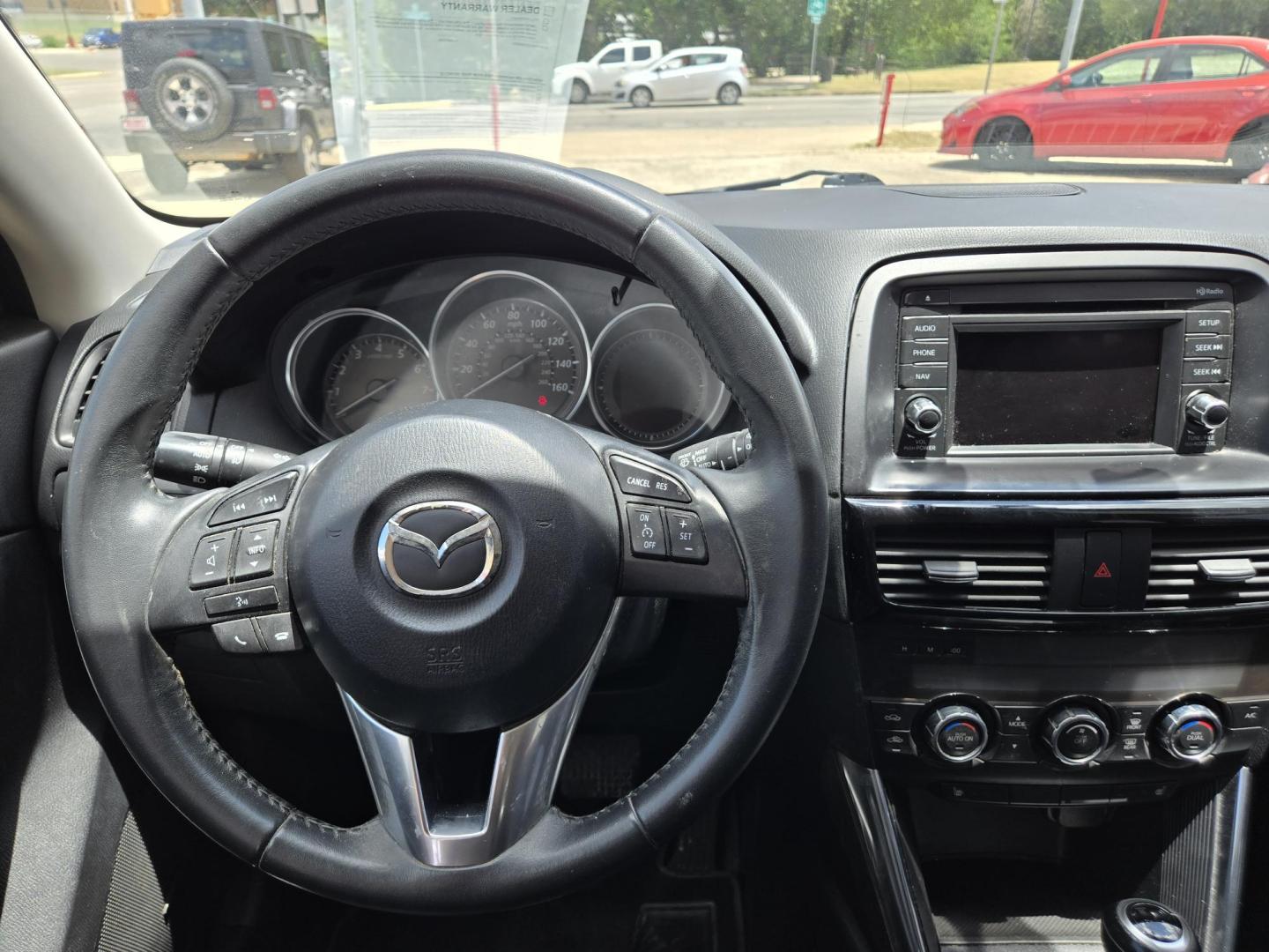 2013 Black Mazda CX-5 Grand Touring (JM3KE2DE9D0) with an 2.0L I4 F DOHC 16V engine, 6-Speed Automatic transmission, located at 503 West Court, Seguin, TX, 78155, (830) 379-3373, 29.568621, -97.969803 - 2013 Mazda CX-5 Grand Touring with a 2.0L I4 F DOHC 16V, Automatic, Tilt, Cruise, AM/FM/CD Touchscreen Stereo, Power Windows, Locks, Seat and Side Mirrors, Bluetooth, Leather Seating, Power Sunroof, Dual Climate Control, Heated Seats, Navigation System, Alloy Wheels, Backup Camera, Rear Wiper, Rear - Photo#5