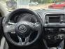 2013 Black Mazda CX-5 Grand Touring (JM3KE2DE9D0) with an 2.0L I4 F DOHC 16V engine, 6-Speed Automatic transmission, located at 503 West Court, Seguin, TX, 78155, (830) 379-3373, 29.568621, -97.969803 - 2013 Mazda CX-5 Grand Touring with a 2.0L I4 F DOHC 16V, Automatic, Tilt, Cruise, AM/FM/CD Touchscreen Stereo, Power Windows, Locks, Seat and Side Mirrors, Bluetooth, Leather Seating, Power Sunroof, Dual Climate Control, Heated Seats, Navigation System, Alloy Wheels, Backup Camera, Rear Wiper, Rear - Photo#5