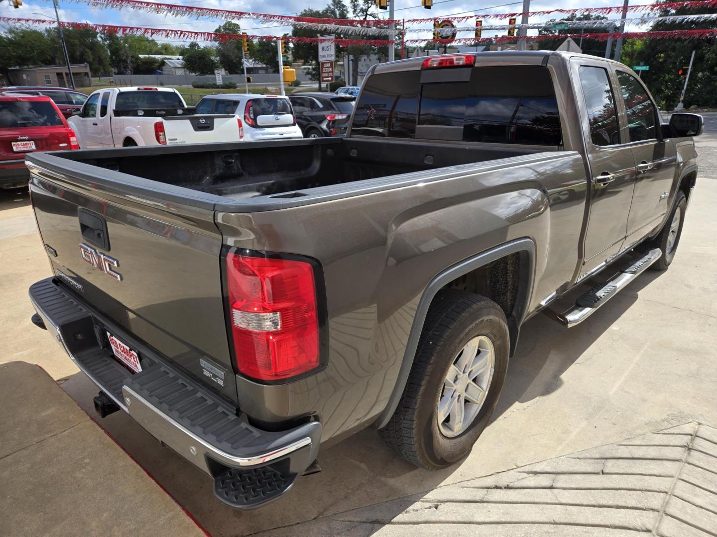 2013 Pewter GMC Sierra 1500 SLE Ext. Cab 2WD (1GTR1UEC8EZ) with an 5.3L V8 OHV 16V engine, 6-Speed Automatic transmission, located at 503 West Court, Seguin, TX, 78155, (830) 379-3373, 29.568621, -97.969803 - 2013 GMC Sierra 1500 SLE Ext. Cab 2WD with a 5.3L V8 OHV 16V, Automatic, Tilt, Cruise, AM/FM/CD Touchscreen Stereo, Power Windows, Locks, Seat and Side Mirrors, Bluetooth, Dual Climate Control, Front Bench Seating, Onstar Capability, Tinted Windows, Trailer Towing, Alloy Wheels, Rear Defroster and m - Photo#2