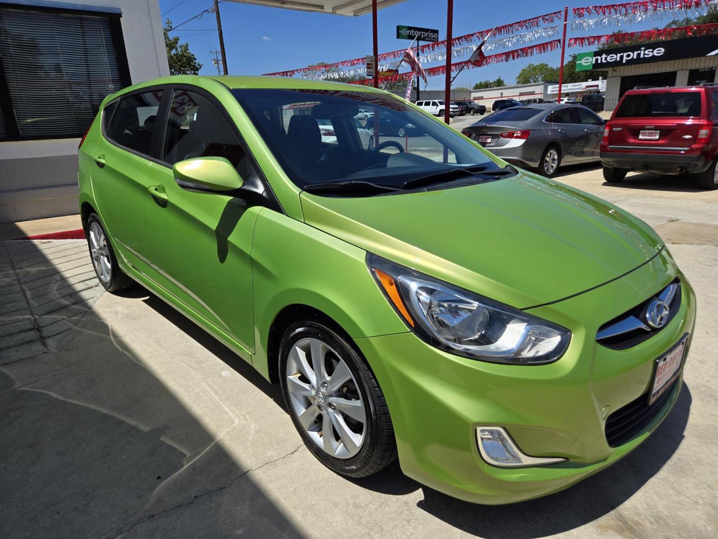2013 Green Hyundai Accent SE 5-Door (KMHCU5AE3DU) with an 1.6L L4 DOHC 16V engine, Automatic transmission, located at 503 West Court, Seguin, TX, 78155, (830) 379-3373, 29.568621, -97.969803 - A Mean Green Machine! 2013 Hyundai Accent SE 5-Door with a 1.6L L4 DOHC 16V, Automatic, Tilt, Cruise, AM/FM/CD/AUX Stereo, Power Windows, Locks and Side Mirrors, Bluetooth, Alloy Wheels, Rear Wiper, Rear Defroster and more!! - Photo#1
