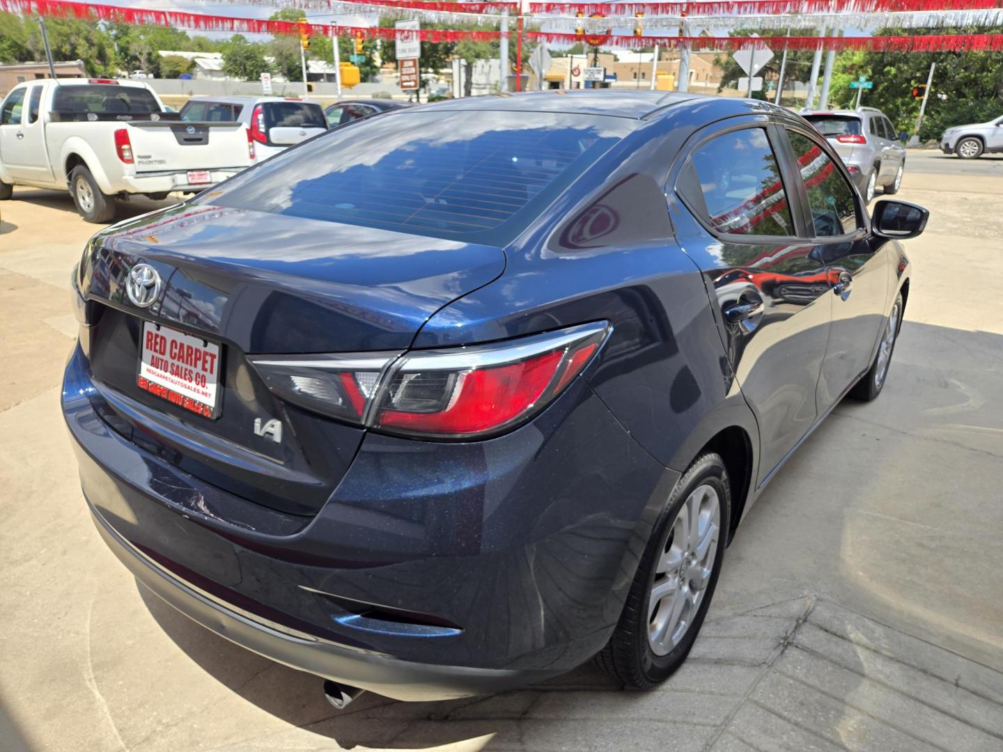 2017 BLUE Toyota Yaris iA (3MYDLBYV0HY) with an 1.5L L4 DOHC 16V engine, Automatic transmission, located at 503 West Court, Seguin, TX, 78155, (830) 379-3373, 29.568621, -97.969803 - 2017 Toyota Yaris iA with a 1.5L L4 DOHC 16V, Automatic, Tilt, Cruise, AM/FM/AUX Stereo, Power Windows, Locks and Side Mirrors, Bluetooth, Tinted Windows, Alloy Wheels, Backup Camera, Rear Defroster and more!! - Photo#2