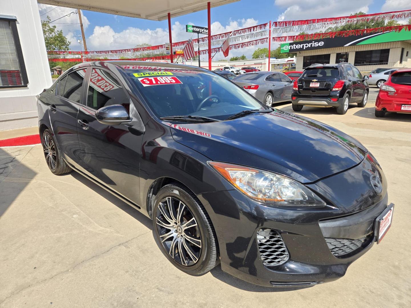 2012 Black Mazda MAZDA3 i Sport 4-Door (JM1BL1UF4C1) with an 2.0L L4 DOHC 16V engine, Manual Transmission transmission, located at 503 West Court, Seguin, TX, 78155, (830) 379-3373, 29.568621, -97.969803 - 2012 Mazda MAZDA3 i Sport 4-Door with a 2.0L L4 DOHC 16V, Standard Transmission, Tilt, AM/FM/CD/AUX Stereo, Power Windows, Locks and Side Mirrors, Tinted Windows, Custom Alloy Wheels, Rear Defroster and more!! - Photo#1