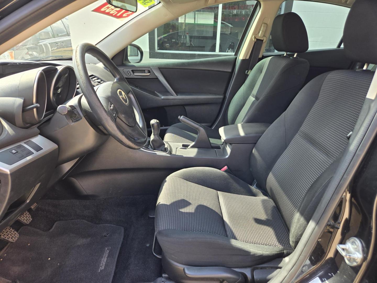 2012 Black Mazda MAZDA3 i Sport 4-Door (JM1BL1UF4C1) with an 2.0L L4 DOHC 16V engine, Manual Transmission transmission, located at 503 West Court, Seguin, TX, 78155, (830) 379-3373, 29.568621, -97.969803 - 2012 Mazda MAZDA3 i Sport 4-Door with a 2.0L L4 DOHC 16V, Standard Transmission, Tilt, AM/FM/CD/AUX Stereo, Power Windows, Locks and Side Mirrors, Tinted Windows, Custom Alloy Wheels, Rear Defroster and more!! - Photo#4