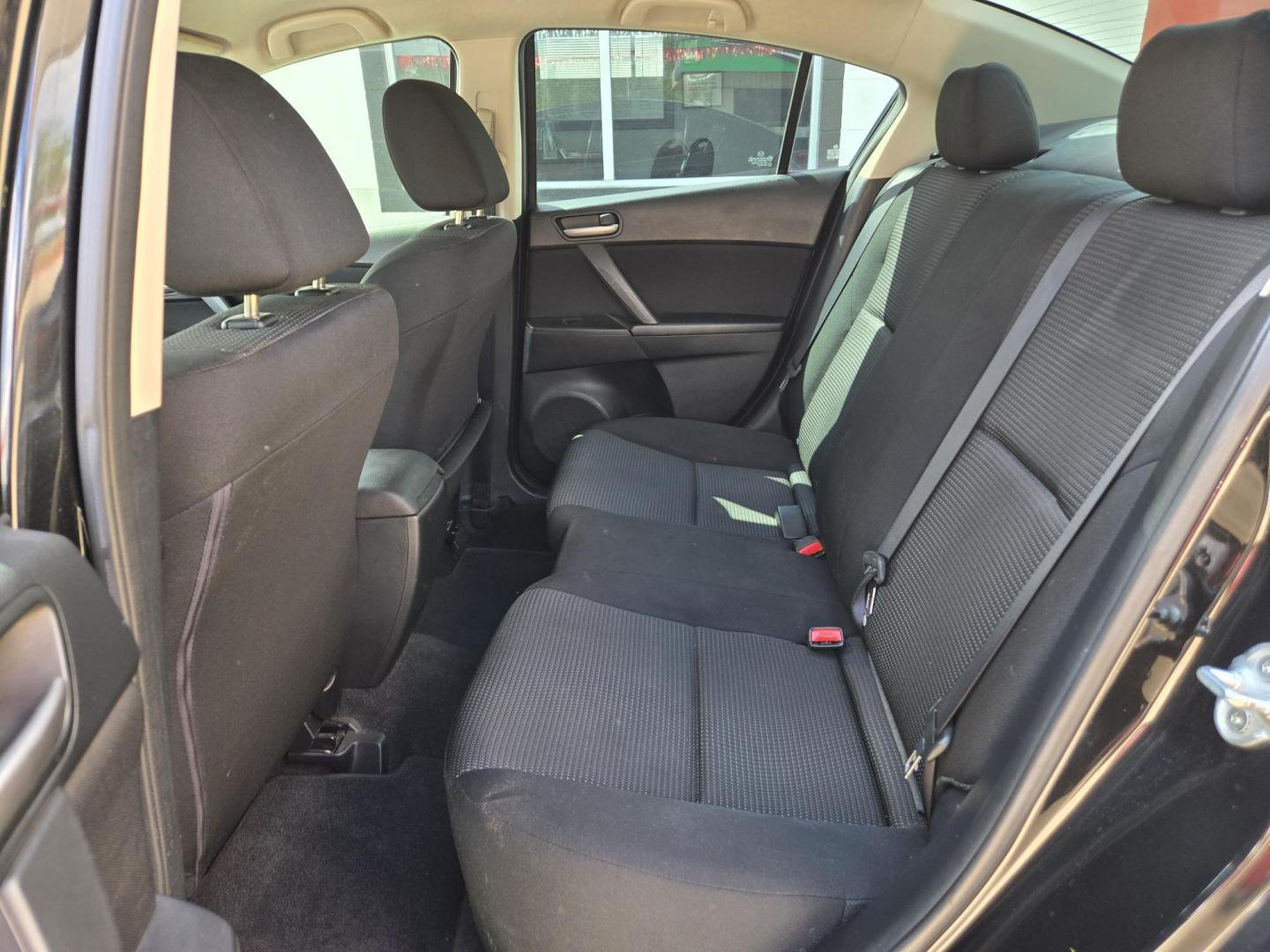 2012 Black Mazda MAZDA3 i Sport 4-Door (JM1BL1UF4C1) with an 2.0L L4 DOHC 16V engine, Manual Transmission transmission, located at 503 West Court, Seguin, TX, 78155, (830) 379-3373, 29.568621, -97.969803 - 2012 Mazda MAZDA3 i Sport 4-Door with a 2.0L L4 DOHC 16V, Standard Transmission, Tilt, AM/FM/CD/AUX Stereo, Power Windows, Locks and Side Mirrors, Tinted Windows, Custom Alloy Wheels, Rear Defroster and more!! - Photo#5