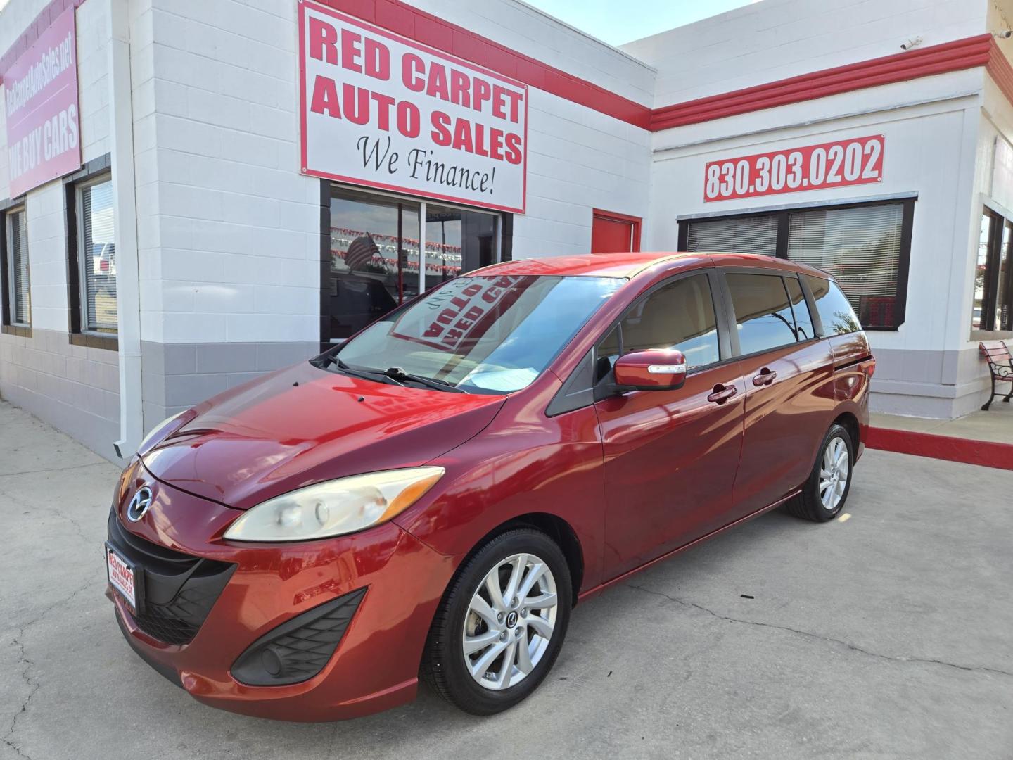 2014 Red Mazda MAZDA5 Sport AT (JM1CW2BL2E0) with an 2.5L L4 DOHC 16V engine, 5-Speed Automatic transmission, located at 503 West Court, Seguin, TX, 78155, (830) 379-3373, 29.568621, -97.969803 - 2014 Mazda MAZDA5 Sport with a 2.5L L4 DOHC 16V, Automatic, Tilt, Cruise, AM/FM/CD Stereo, Power Windows, Locks and Side Mirrors, Third Row Seating, Foldable Rear Center Console, Alloy Wheels, Tinted Windows, Rear Wiper, Rear Defroster and more!! - Photo#0