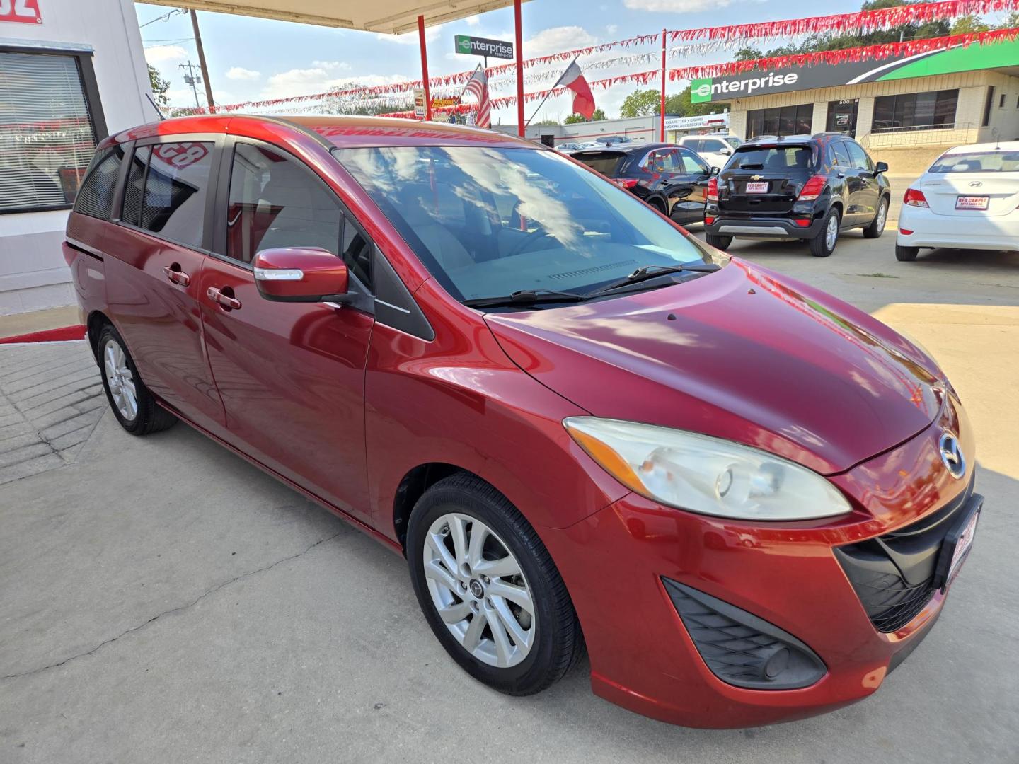 2014 Red Mazda MAZDA5 Sport AT (JM1CW2BL2E0) with an 2.5L L4 DOHC 16V engine, 5-Speed Automatic transmission, located at 503 West Court, Seguin, TX, 78155, (830) 379-3373, 29.568621, -97.969803 - 2014 Mazda MAZDA5 Sport with a 2.5L L4 DOHC 16V, Automatic, Tilt, Cruise, AM/FM/CD Stereo, Power Windows, Locks and Side Mirrors, Third Row Seating, Foldable Rear Center Console, Alloy Wheels, Tinted Windows, Rear Wiper, Rear Defroster and more!! - Photo#1
