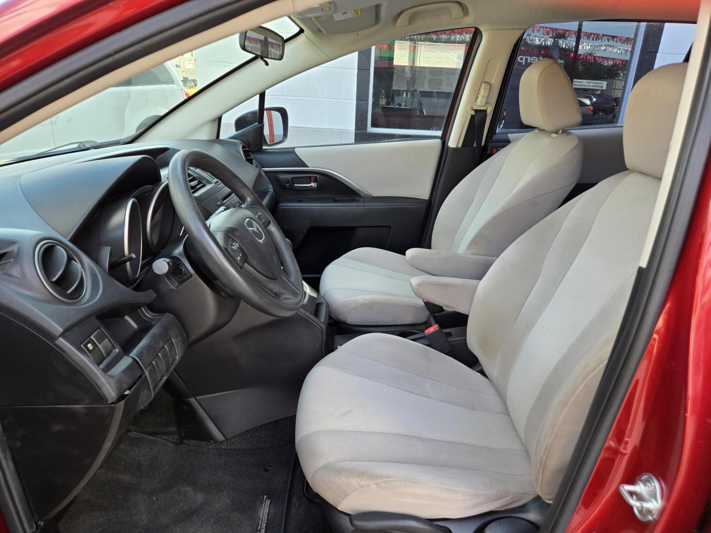 2014 Red Mazda MAZDA5 Sport AT (JM1CW2BL2E0) with an 2.5L L4 DOHC 16V engine, 5-Speed Automatic transmission, located at 503 West Court, Seguin, TX, 78155, (830) 379-3373, 29.568621, -97.969803 - 2014 Mazda MAZDA5 Sport with a 2.5L L4 DOHC 16V, Automatic, Tilt, Cruise, AM/FM/CD Stereo, Power Windows, Locks and Side Mirrors, Third Row Seating, Foldable Rear Center Console, Alloy Wheels, Tinted Windows, Rear Wiper, Rear Defroster and more!! - Photo#4
