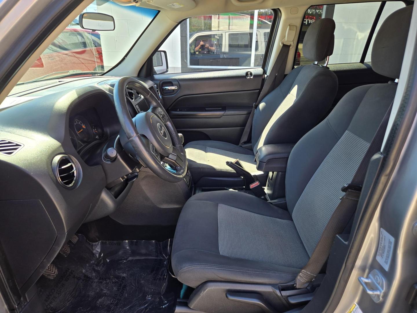 2015 SILVER Jeep Patriot Latitude 2WD (1C4NJPFB8FD) with an 2.4L L4 DOHC 16V engine, Manual Transmission transmission, located at 503 West Court, Seguin, TX, 78155, (830) 379-3373, 29.568621, -97.969803 - 2015 Jeep Patriot Latitude 2WD with a 2.4L L4 DOHC 16V, Manual Transmission, Tilt, Cruise, AM/FM/CD/AUX Touchscreen Stereo, Power Windows, Locks and Side Mirrors, Bluetooth, Heated Seats, Tinted Windows, Alloy Wheels, Rear Wiper, Rear Defroster and more!! - Photo#4