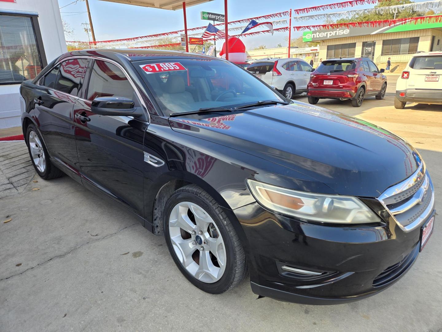 2011 Black Ford Taurus SEL FWD (1FAHP2EWXBG) with an 3.5L V6 DOHC 24V engine, 6-Speed Automatic transmission, located at 503 West Court, Seguin, TX, 78155, (830) 379-3373, 29.568621, -97.969803 - 2011 Ford Taurus SEL FWD with a 3.5L V6 DOHC 24V, Automatic, Tilt, Cruise, AM/FM/CD Stereo, Power Windows, Locks, Seat and Side Mirrors, Bluetooth, Leather Seating, Heated Seats, Tinted Windows, Dual Climate Control, Alloy Wheels, Rear Defroster and more!! - Photo#1