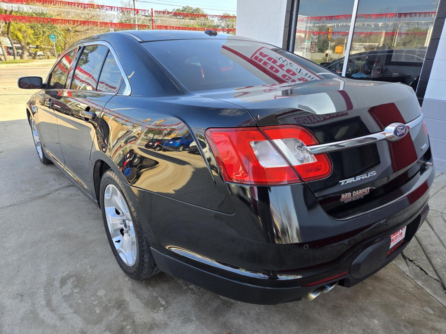 2011 Black Ford Taurus SEL FWD (1FAHP2EWXBG) with an 3.5L V6 DOHC 24V engine, 6-Speed Automatic transmission, located at 503 West Court, Seguin, TX, 78155, (830) 379-3373, 29.568621, -97.969803 - 2011 Ford Taurus SEL FWD with a 3.5L V6 DOHC 24V, Automatic, Tilt, Cruise, AM/FM/CD Stereo, Power Windows, Locks, Seat and Side Mirrors, Bluetooth, Leather Seating, Heated Seats, Tinted Windows, Dual Climate Control, Alloy Wheels, Rear Defroster and more!! - Photo#3