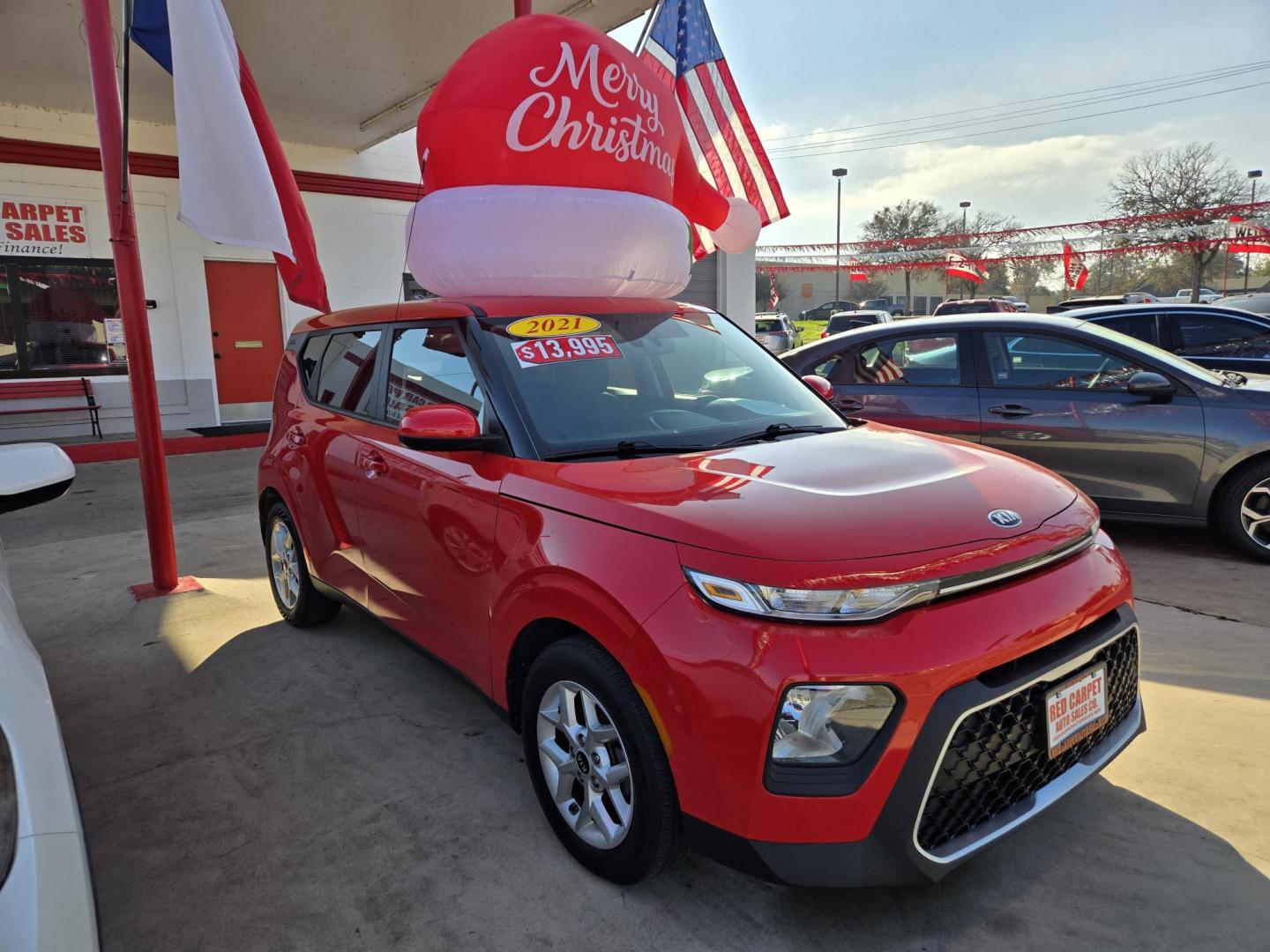 2021 Red Kia Soul LX CVT (KNDJ23AU2M7) with an 2.0L L4 DOHC 16V engine, Automatic transmission, located at 503 West Court, Seguin, TX, 78155, (830) 379-3373, 29.568621, -97.969803 - 2021 Kia Soul LX with a 2.0L L4 DOHC 16V, Automatic, Tilt, Cruise, AM/FM Touchscreen Stereo, Power Windows, Locks, Seat and Side Mirrors, Bluetooth, Backup Camera, Alloy Wheels, Rear Wiper, Rear Defroster and more!! *Merry Christmas inflatable not included, Get your own!* - Photo#1