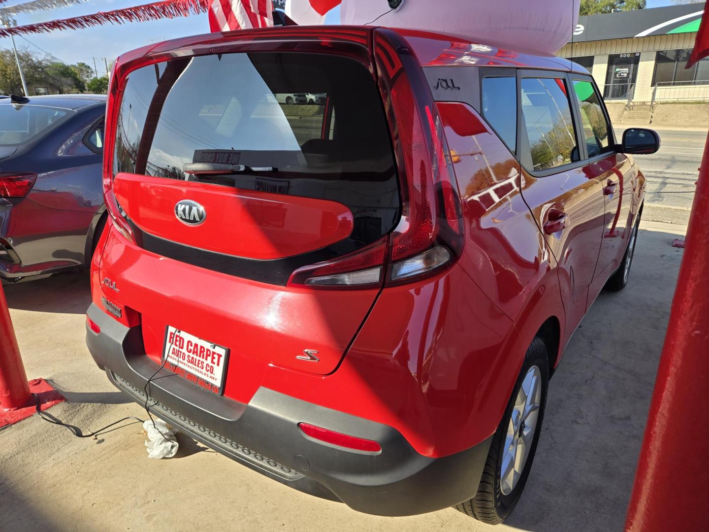 2021 Red Kia Soul LX CVT (KNDJ23AU2M7) with an 2.0L L4 DOHC 16V engine, Automatic transmission, located at 503 West Court, Seguin, TX, 78155, (830) 379-3373, 29.568621, -97.969803 - 2021 Kia Soul LX with a 2.0L L4 DOHC 16V, Automatic, Tilt, Cruise, AM/FM Touchscreen Stereo, Power Windows, Locks, Seat and Side Mirrors, Bluetooth, Backup Camera, Alloy Wheels, Rear Wiper, Rear Defroster and more!! *Merry Christmas inflatable not included, Get your own!* - Photo#2
