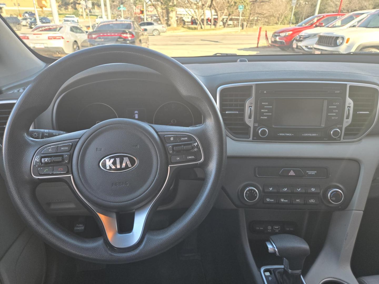 2018 SILVER Kia Sportage LX FWD (KNDPM3AC1J7) with an 2.4L V6 DOHC 24V engine, 6A transmission, located at 503 West Court, Seguin, TX, 78155, (830) 379-3373, 29.568621, -97.969803 - 2018 Kia Sportage LX FWD with a 2.4L V6 DOHC 24V, Automatic, Tilt, Cruise, AM/FM/CD/AUX Stereo, Power Windows, Locks and Side Mirrors, Bluetooth, Tinted Windows, Automatic Headlights, Alloy Wheels, Backup Camera, Rear Wiper, Rear Defroster and more!! - Photo#5
