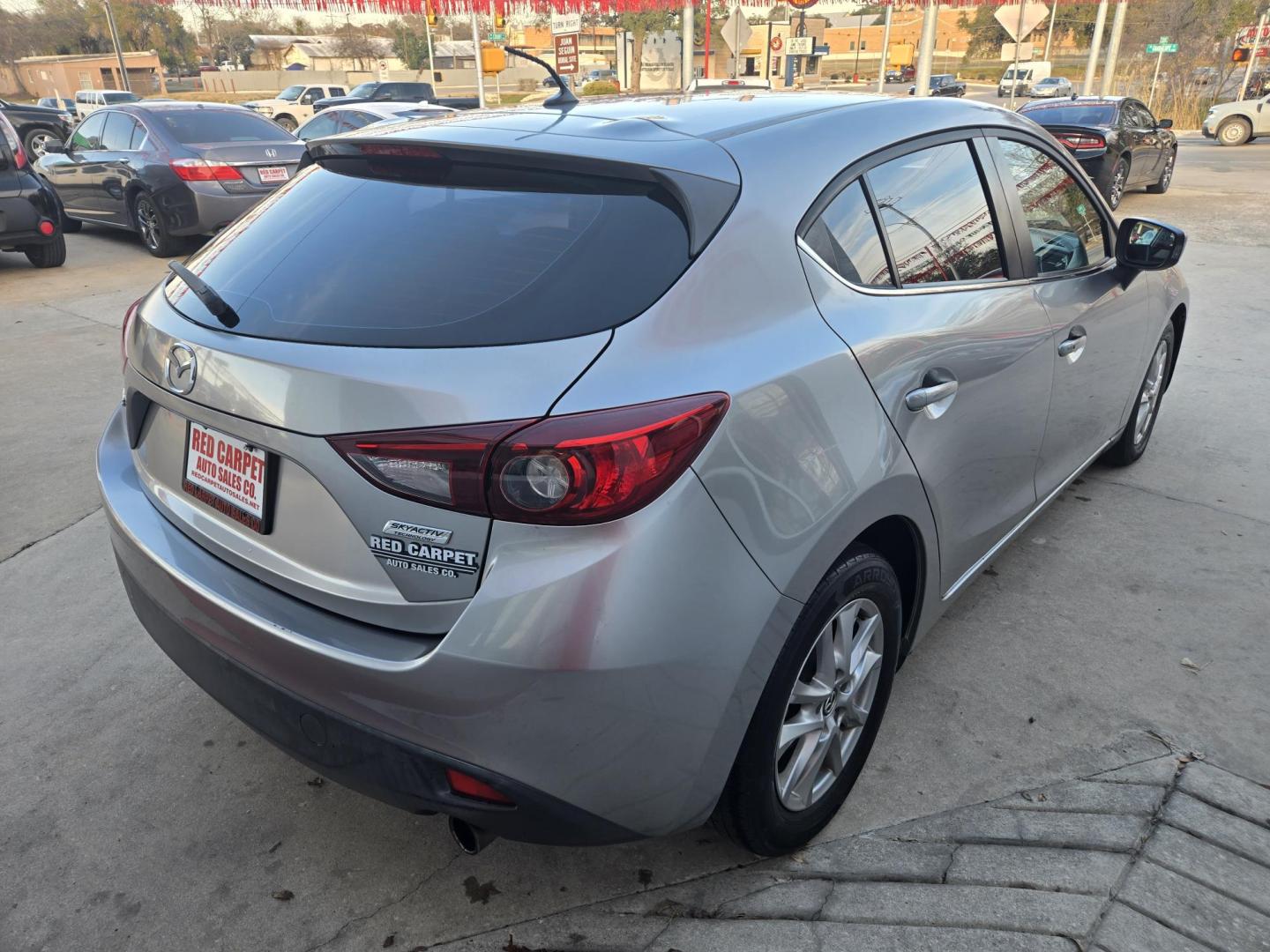 2015 SILVER Mazda MAZDA3 i Touring AT 5-Door (JM1BM1L76F1) with an 2.0L L4 DOHC 16V engine, 6-Speed Automatic transmission, located at 503 West Court, Seguin, TX, 78155, (830) 379-3373, 29.568621, -97.969803 - 2015 Mazda MAZDA3 i Touring with a 2.0L L4 DOHC 16V, Automatic, Tilt, Cruise, AM/FM Stereo, Power Windows, Locks and Side Mirrors, Bluetooth, Tinted Windows, Alloy Wheels, Backup Camera, Rear Wiper, Rear Defroster and more!! - Photo#2