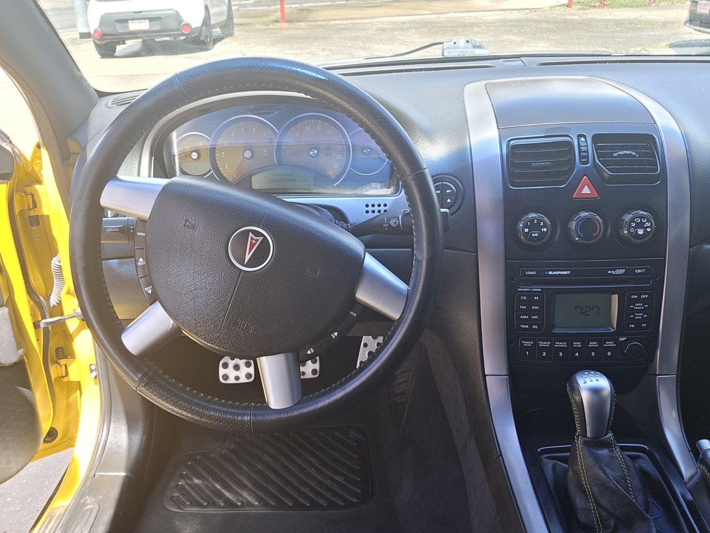 2004 YELLOW Pontiac GTO Coupe (6G2VX12GX4L) with an 5.7L V8 OHV 16V engine, Manual Transmission transmission, located at 503 West Court, Seguin, TX, 78155, (830) 379-3373, 29.568621, -97.969803 - 2004 Pontiac GTO Coupe with a 5.7L V8 OHV 16V, Standard Transmission, Tilt, AM/FM/6 Disc CD Stereo System, Power Windows, Locks and Seat, Leather Seating, Automatic Headlights, Rear Defroster and more!! - Photo#5