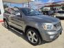 2013 Pewter Jeep Grand Cherokee Overland 4WD (1C4RJFCT1DC) with an 5.7L V8 OHV 16V engine, 5-Speed Automatic transmission, located at 503 West Court, Seguin, TX, 78155, (830) 379-3373, 29.568621, -97.969803- Photo#1