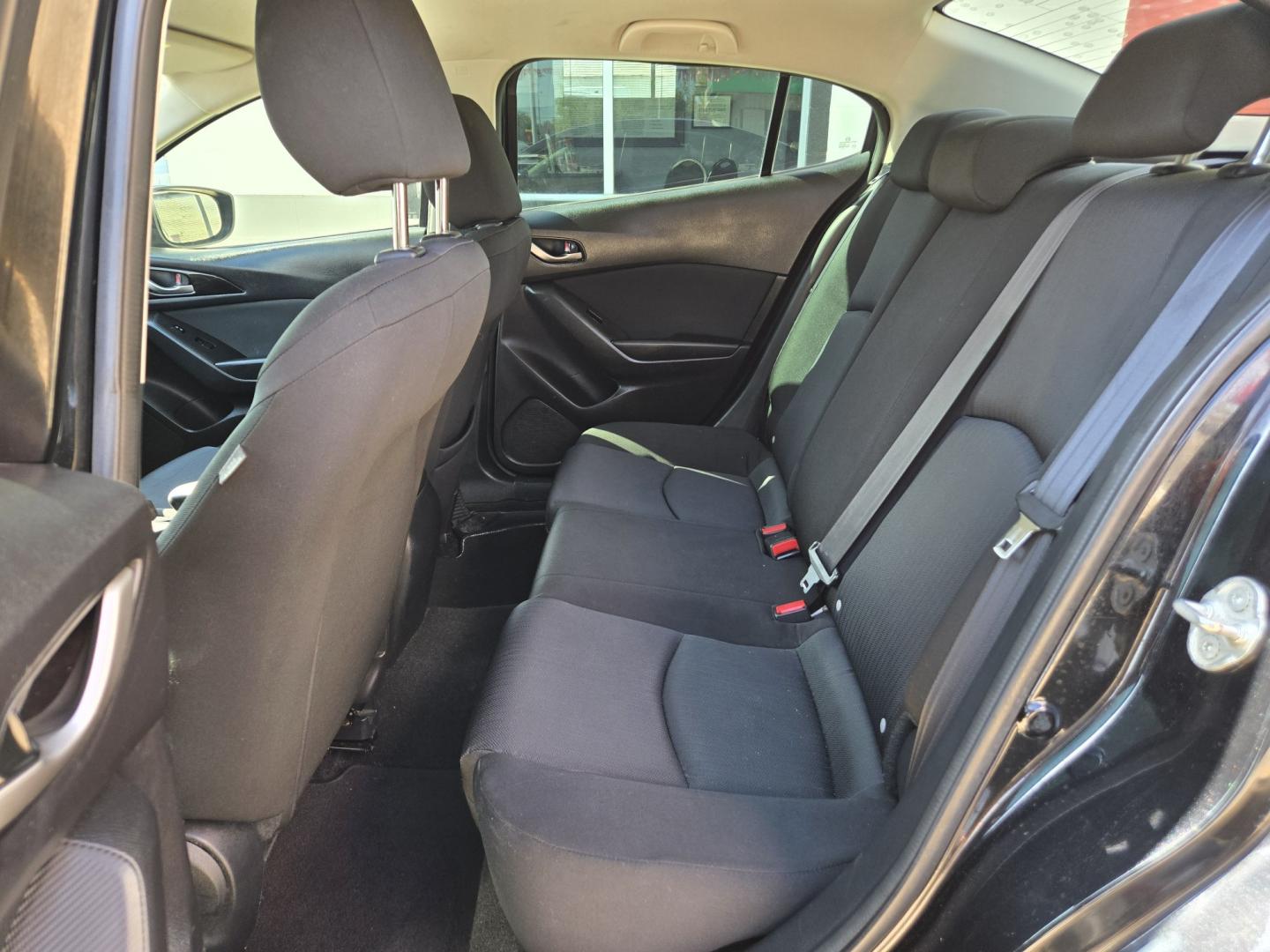 2015 Black Mazda MAZDA3 i Sport AT 4-Door (3MZBM1U7XFM) with an 2.0L L4 DOHC 16V engine, 6-Speed Automatic transmission, located at 503 West Court, Seguin, TX, 78155, (830) 379-3373, 29.568621, -97.969803 - 2015 Mazda MAZDA3 i Sport AT 4-Door with a 2.0L L4 DOHC 16V, Automatic, Tilt, Cruise, AM/FM/AUX Stereo, Power Windows, Locks and Side Mirrors, Bluetooth, Tinted Windows, Rear Defroster and more!!- Photo#6