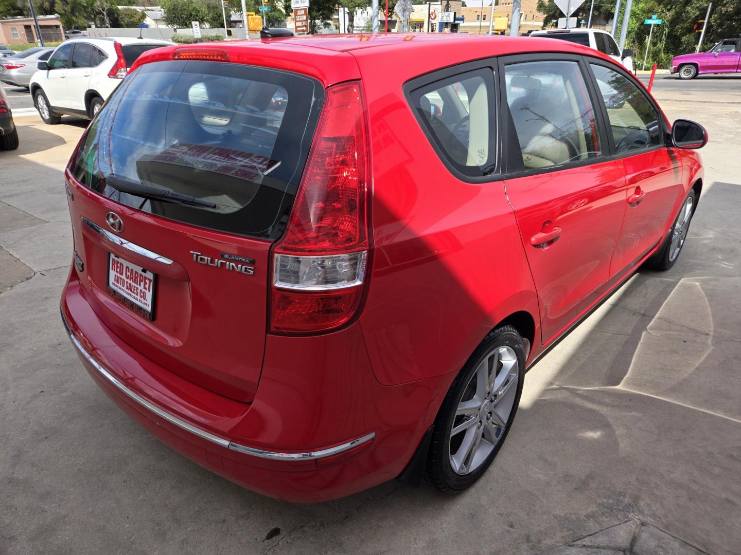 2009 RED Hyundai Elantra Automatic (KMHDC86E99U) with an 2.0L L4 DOHC 16V engine, 4A transmission, located at 503 West Court, Seguin, TX, 78155, (830) 379-3373, 29.568621, -97.969803- Photo#2