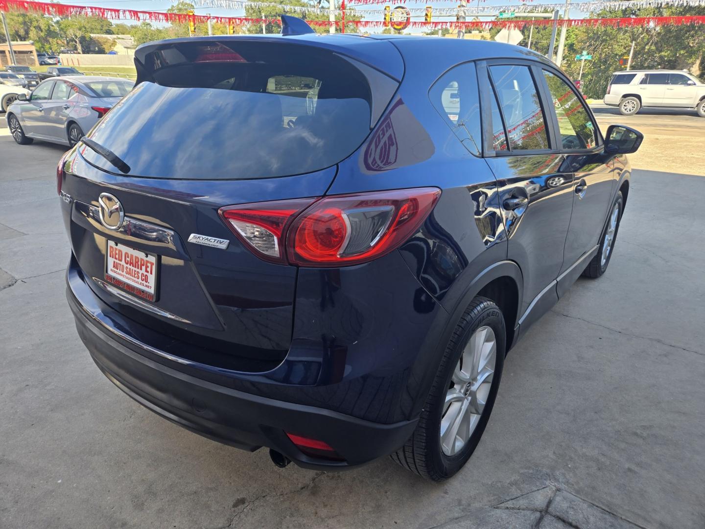 2013 BLUE Mazda CX-5 Grand Touring (JM3KE2DE8D0) with an 2.0L l4 F DOHC 16V engine, 6A transmission, located at 503 West Court, Seguin, TX, 78155, (830) 379-3373, 29.568621, -97.969803 - 2013 Mazda CX-5 Grand Touring with a 2.0L l4 F DOHC 16V, Automatic, Tilt, Cruise, AM/FM/CD Touchscreen Stereo, Power Windows, Locks, Seats and Side Mirrors, Leather Seating, Bluetooth, Dual Climate Control, Power Sunroof, Tinted Windows, Alloy Wheels, Rear Wiper, Rear Defroster and more!!- Photo#2